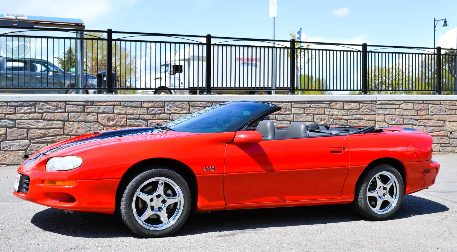 1999 Red /Black Leather Chevrolet Camaro (2G1FP32G6X2) with an 5.7L V8 MPI "LS1" engine, 6 Speed Manual transmission, located at 450 N Russell, Missoula, MT, 59801, (406) 543-6600, 46.874496, -114.017433 - Truly a beautiful car we sold this beauty about 10 years ago and was driven a few hundred miles in that time and was stored indoors Runs,drives and looks as it should all original no modifications True SS convertible with SLP upgrades (we're not certain what those are exactly as there isn't - Photo#0