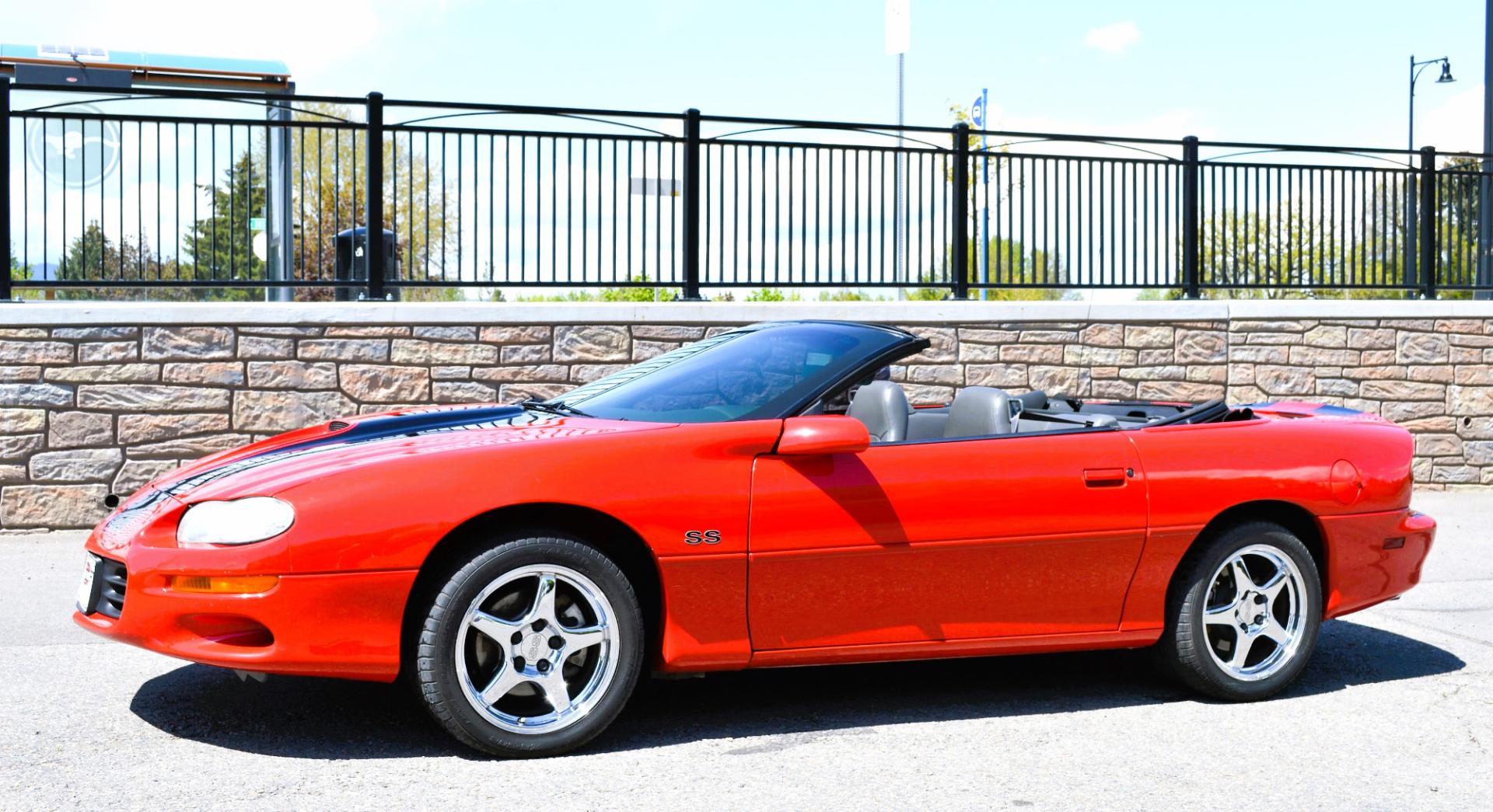 1999 Red /Black Leather Chevrolet Camaro (2G1FP32G6X2) with an 5.7L V8 MPI "LS1" engine, 6 Speed Manual transmission, located at 450 N Russell, Missoula, MT, 59801, (406) 543-6600, 46.874496, -114.017433 - Truly a beautiful car we sold this beauty about 10 years ago and was driven a few hundred miles in that time and was stored indoors Runs,drives and looks as it should all original no modifications True SS convertible with SLP upgrades (we're not certain what those are exactly as there isn't - Photo#2