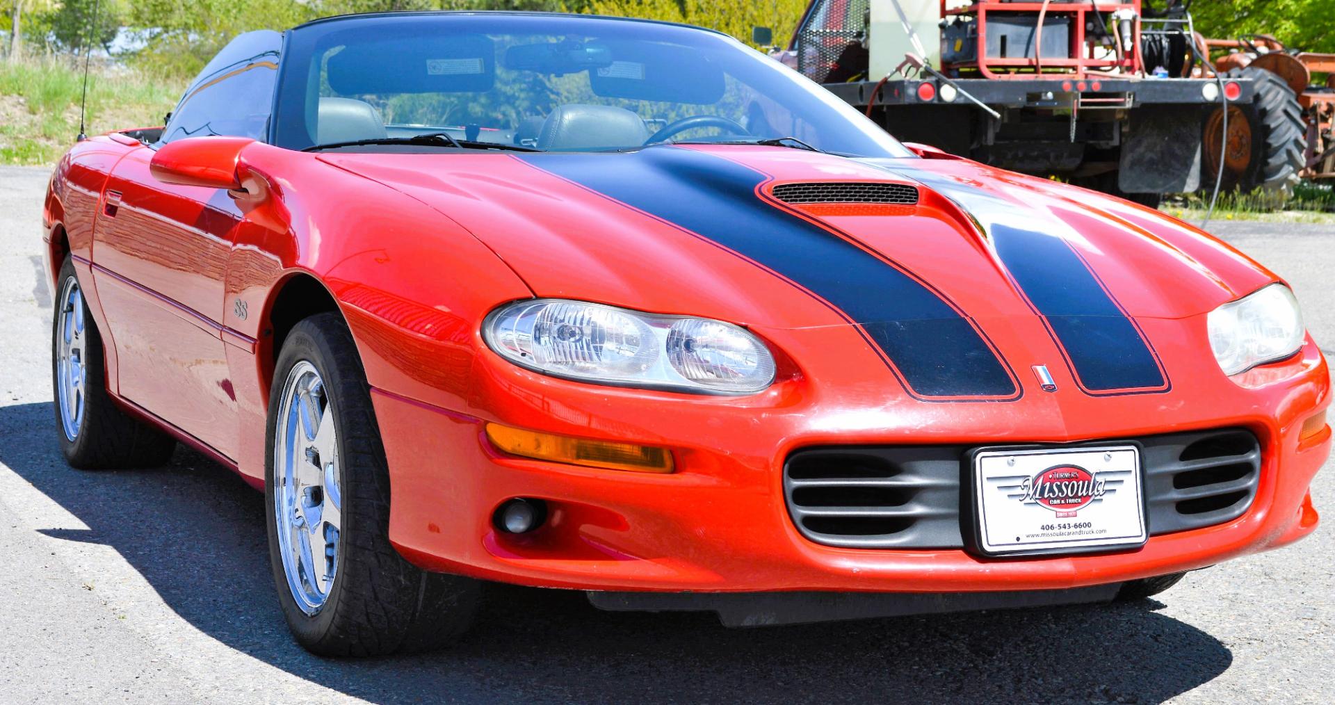 1999 Red /Black Leather Chevrolet Camaro (2G1FP32G6X2) with an 5.7L V8 MPI "LS1" engine, 6 Speed Manual transmission, located at 450 N Russell, Missoula, MT, 59801, (406) 543-6600, 46.874496, -114.017433 - Truly a beautiful car we sold this beauty about 10 years ago and was driven a few hundred miles in that time and was stored indoors Runs,drives and looks as it should all original no modifications True SS convertible with SLP upgrades (we're not certain what those are exactly as there isn't - Photo#4