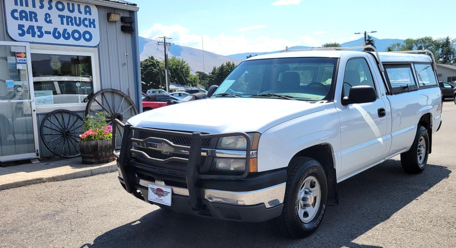 2004 White /Black Chevrolet Silverado 1500 Long Bed 4WD (1GCEK14V04Z) with an 4.8L V8 OHV 16V engine, 5 speed manual transmission, located at 450 N Russell, Missoula, MT, 59801, (406) 543-6600, 46.874496, -114.017433 - Solid 2 Owner 4WD Pickup. Single Cab Long Box. 4.8L V8 Engine. 5 Speed Manual Transmission. Aluminum Topper. Air Conditioning. AM FM Radio. Good Tires. Financing is not available. - Photo#1