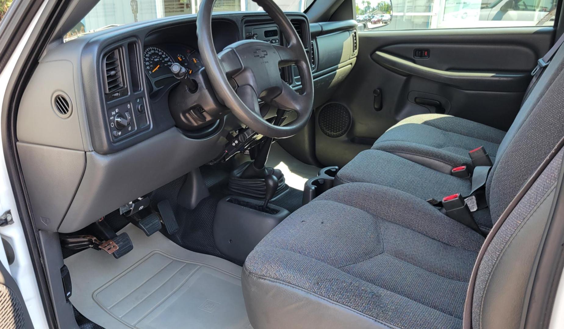 2004 White /Black Chevrolet Silverado 1500 Long Bed 4WD (1GCEK14V04Z) with an 4.8L V8 OHV 16V engine, 5 speed manual transmission, located at 450 N Russell, Missoula, MT, 59801, (406) 543-6600, 46.874496, -114.017433 - Solid 2 Owner 4WD Pickup. Single Cab Long Box. 4.8L V8 Engine. 5 Speed Manual Transmission. Aluminum Topper. Air Conditioning. AM FM Radio. Good Tires. Financing is not available. - Photo#10