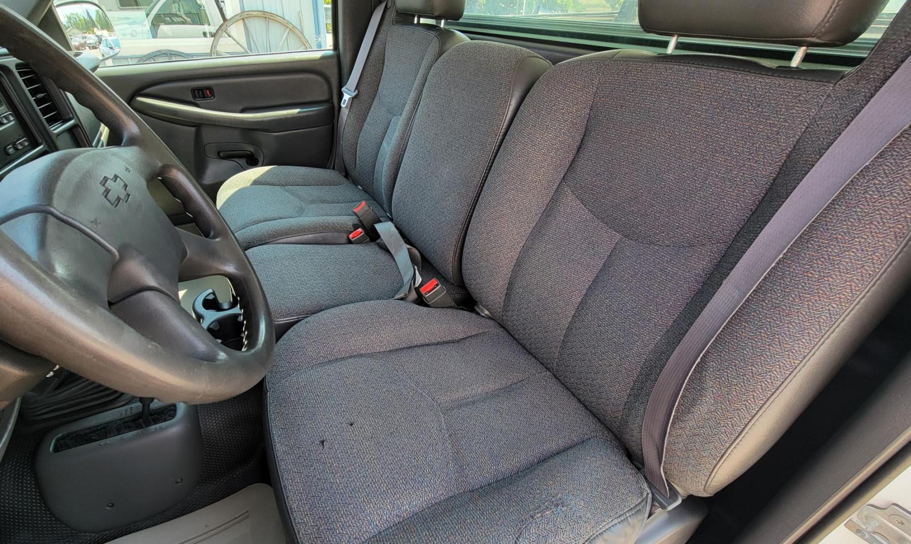 2004 White /Black Chevrolet Silverado 1500 Long Bed 4WD (1GCEK14V04Z) with an 4.8L V8 OHV 16V engine, 5 speed manual transmission, located at 450 N Russell, Missoula, MT, 59801, (406) 543-6600, 46.874496, -114.017433 - Solid 2 Owner 4WD Pickup. Single Cab Long Box. 4.8L V8 Engine. 5 Speed Manual Transmission. Aluminum Topper. Air Conditioning. AM FM Radio. Good Tires. Financing is not available. - Photo#16