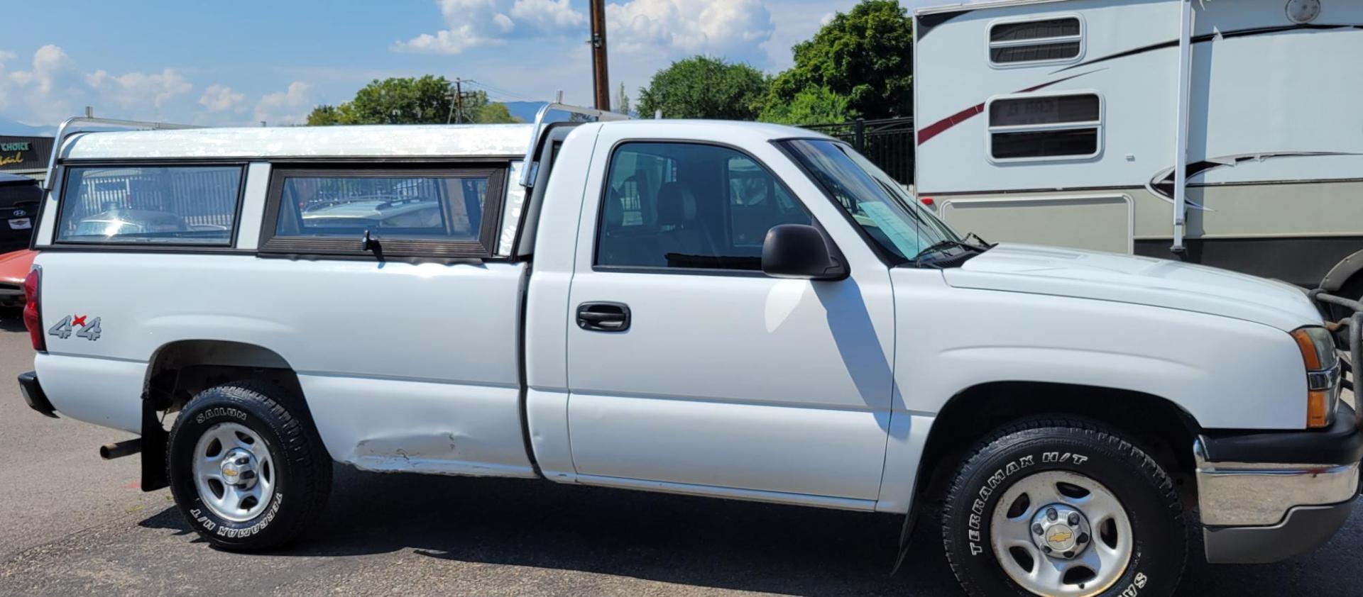 2004 White /Black Chevrolet Silverado 1500 Long Bed 4WD (1GCEK14V04Z) with an 4.8L V8 OHV 16V engine, 5 speed manual transmission, located at 450 N Russell, Missoula, MT, 59801, (406) 543-6600, 46.874496, -114.017433 - Solid 2 Owner 4WD Pickup. Single Cab Long Box. 4.8L V8 Engine. 5 Speed Manual Transmission. Aluminum Topper. Air Conditioning. AM FM Radio. Good Tires. Financing is not available. - Photo#4