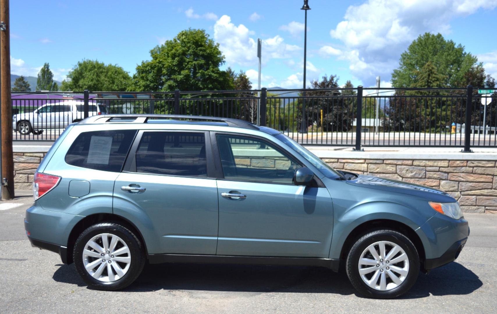 2013 Green Subaru Forester 2.5X Premium (JF2SHADC6DG) with an 2.5L H4 SOHC 16V engine, 5-Speed Manual transmission, located at 450 N Russell, Missoula, MT, 59801, (406) 543-6600, 46.874496, -114.017433 - 2013 Forester. Has Timing Chain not timing belt. 5 Speed Manual transmission. Power Sunroof. Air Conditioning. Heated Seats. Cruise. Tilt. Bluetooth. Backup Camera. - Photo#0