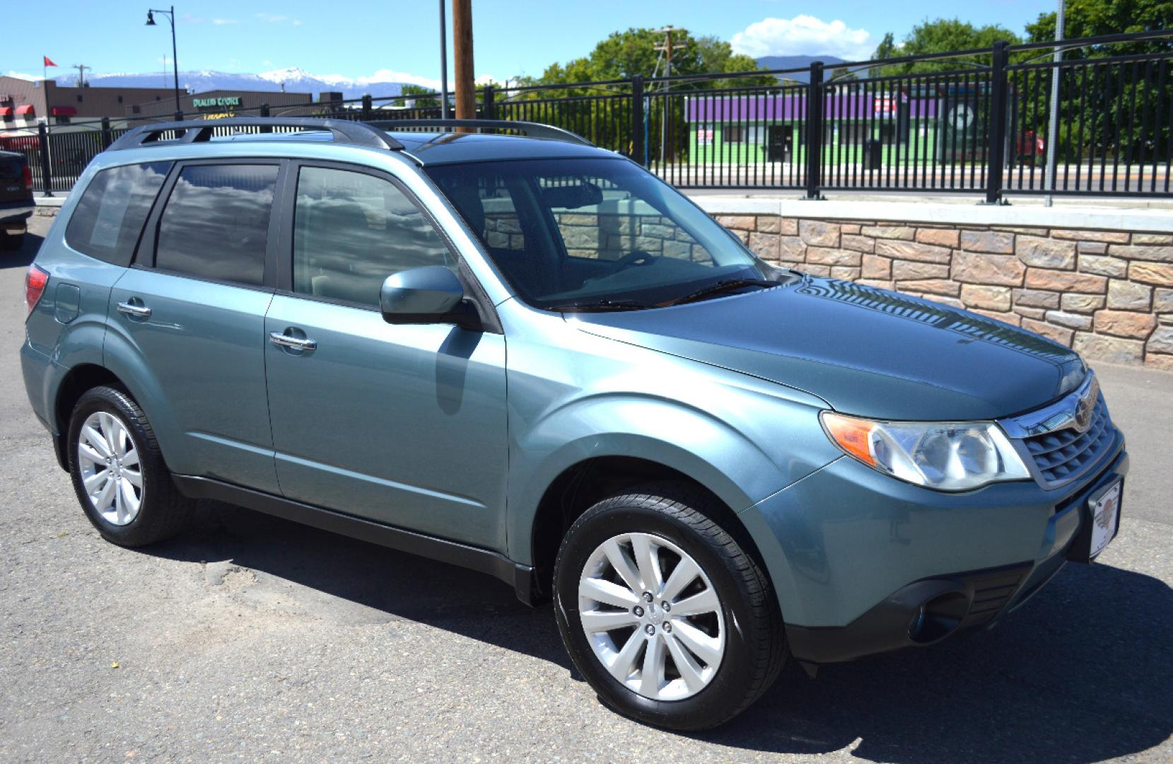 2013 Green Subaru Forester 2.5X Premium (JF2SHADC6DG) with an 2.5L H4 SOHC 16V engine, 5-Speed Manual transmission, located at 450 N Russell, Missoula, MT, 59801, (406) 543-6600, 46.874496, -114.017433 - 2013 Forester. Has Timing Chain not timing belt. 5 Speed Manual transmission. Power Sunroof. Air Conditioning. Heated Seats. Cruise. Tilt. Bluetooth. Backup Camera. - Photo#1