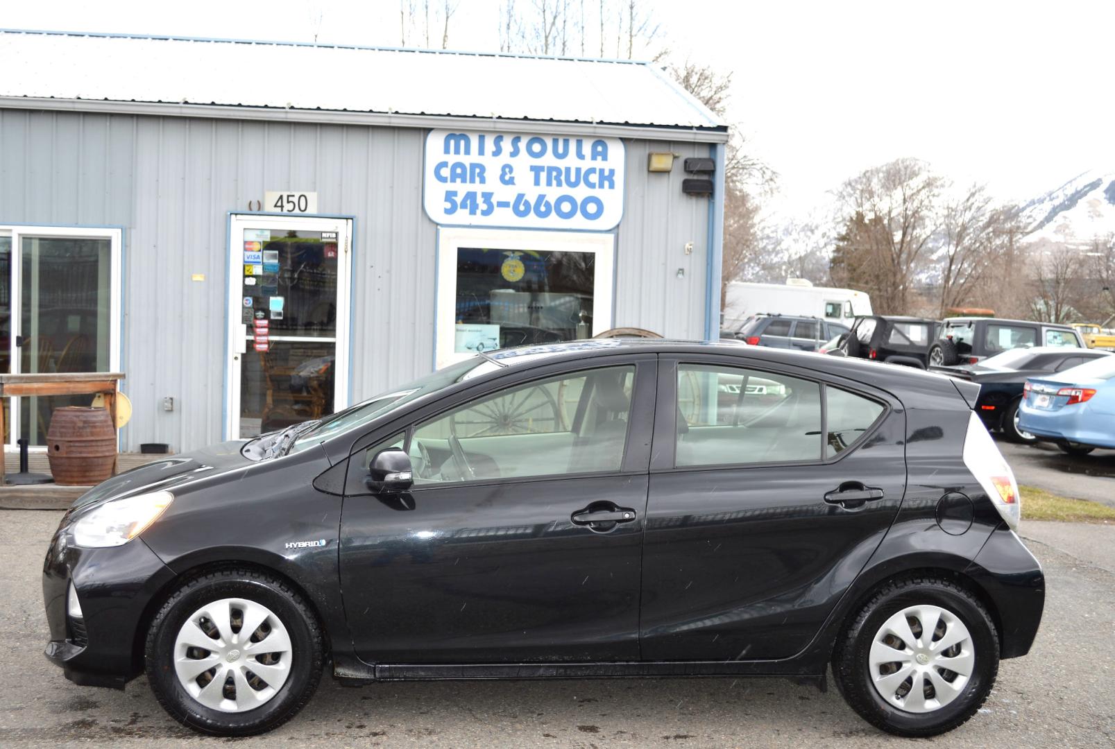 2012 Black Toyota Prius c One (JTDKDTB31C1) with an 1.5L L4 DOHC 16V HYBRID engine, Continuously Variable Transmission transmission, located at 450 N Russell, Missoula, MT, 59801, (406) 543-6600, 46.874496, -114.017433 - Nice Little Hybrid. Great Fuel Economy. Air. Cruise. Tilt. Bluetooth. Power Windows and Locks. - Photo#0