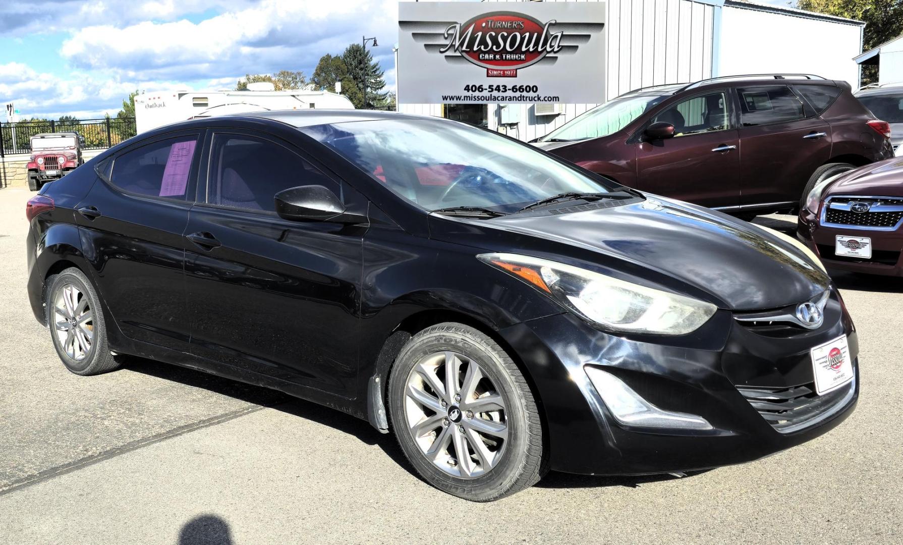 2016 Black Hyundai Elantra Limited (5NPDH4AE9GH) with an 1.8L L4 DOHC 16V engine, 6-Speed Automatic transmission, located at 450 N Russell, Missoula, MT, 59801, (406) 543-6600, 46.874496, -114.017433 - Great Running Sedan. Automatic Transmission. Air. Cruise. Tilt. Backup Camera. Bluetooth. Power Windows and Locks. - Photo#2