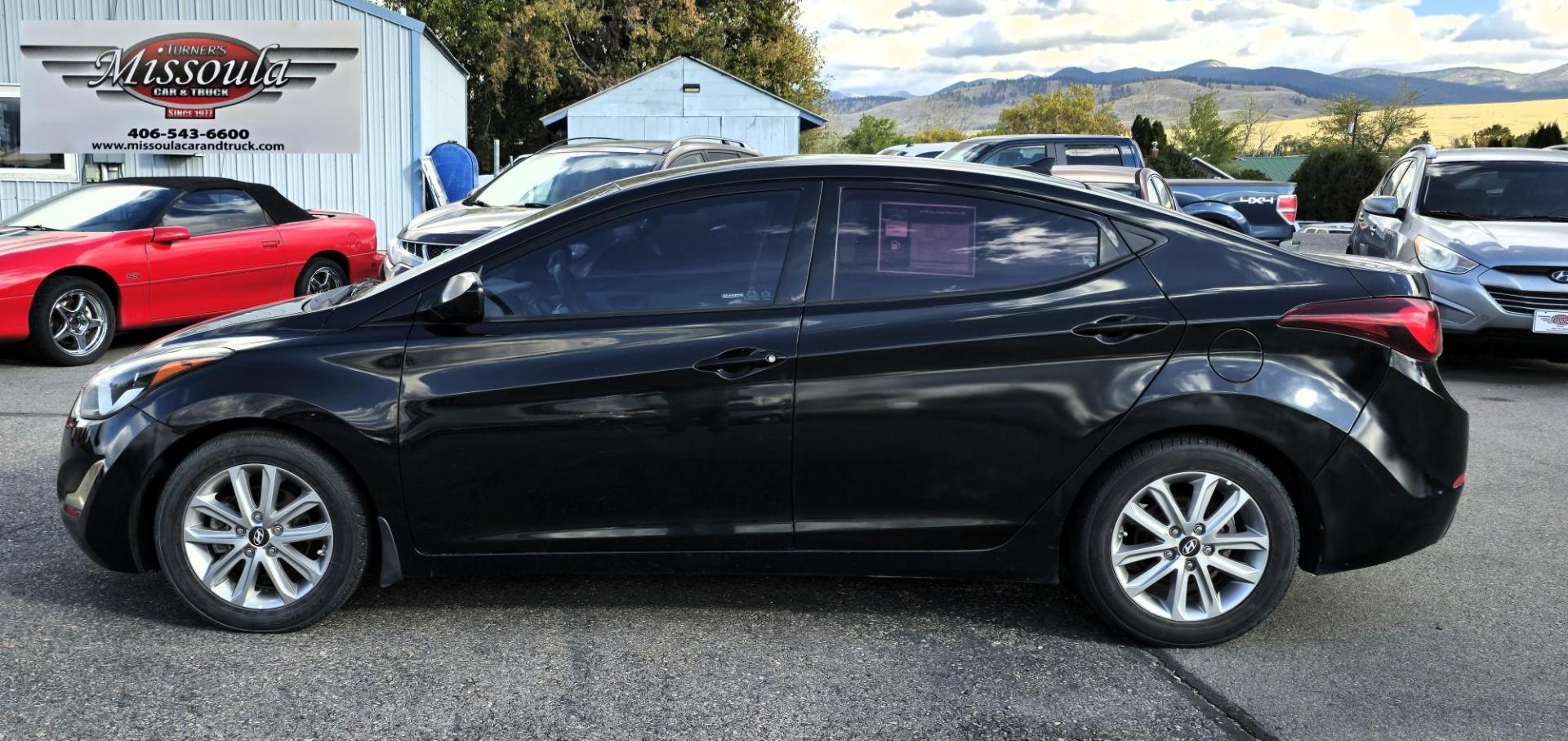 2016 Black Hyundai Elantra Limited (5NPDH4AE9GH) with an 1.8L L4 DOHC 16V engine, 6-Speed Automatic transmission, located at 450 N Russell, Missoula, MT, 59801, (406) 543-6600, 46.874496, -114.017433 - Great Running Sedan. Automatic Transmission. Air. Cruise. Tilt. Backup Camera. Bluetooth. Power Windows and Locks. - Photo#0