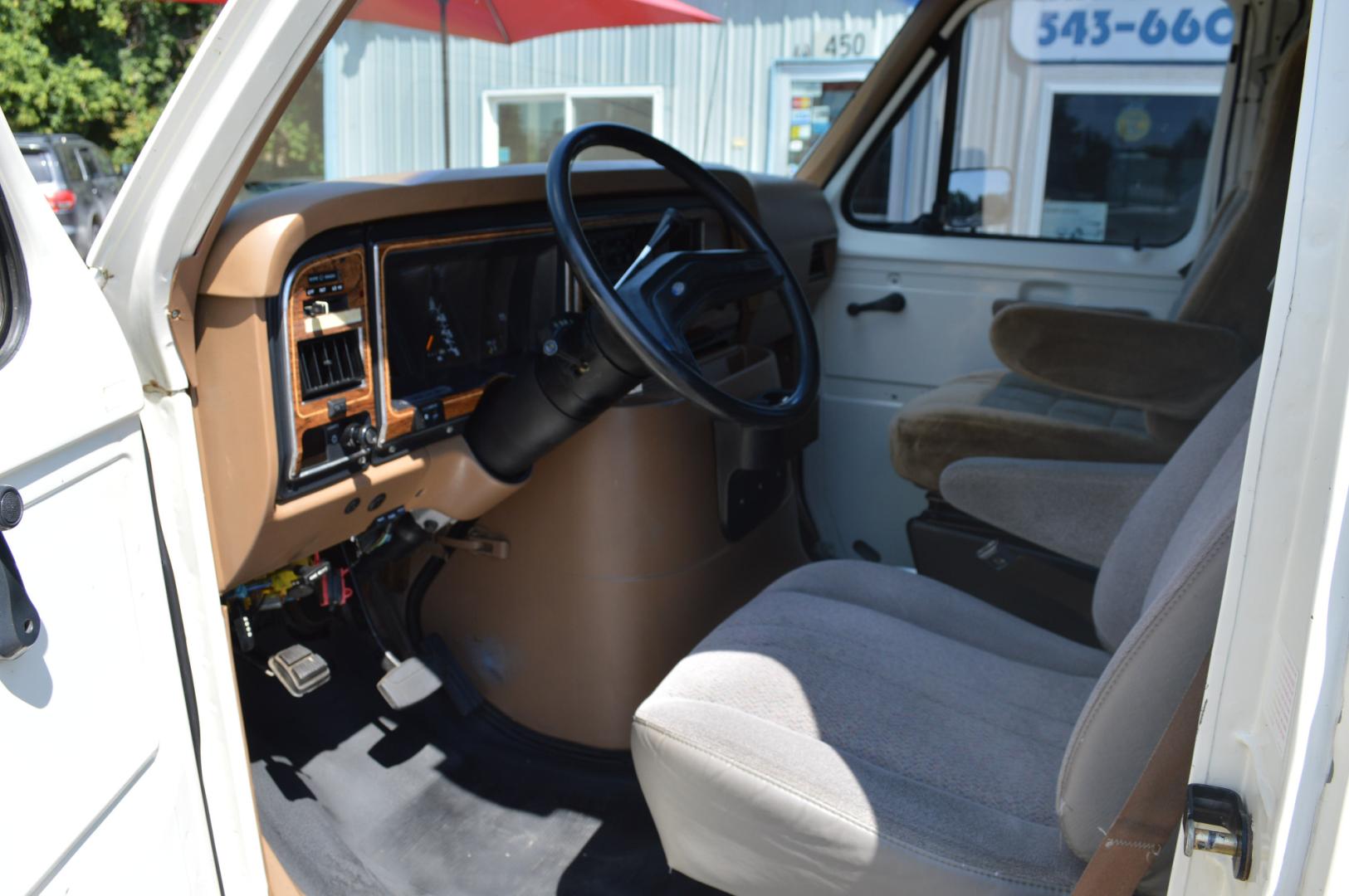 1990 White /Black Ford Econoline E250 (1FTFE24H6LH) with an 5.8L V8 OHV 16V engine, 4-Speed Automatic Overdrive transmission, located at 450 N Russell, Missoula, MT, 59801, (406) 543-6600, 46.874496, -114.017433 - Converted 3/4 Ton Ford Van. Has solar panels on top with a converter for power inside. Had a fold out bed. Comes with a sink that you hook to a 5 gallon water jug. Van Runs great. This vehicle is more then 20 years old and is not eligible for lending through our finance companies. - Photo#13