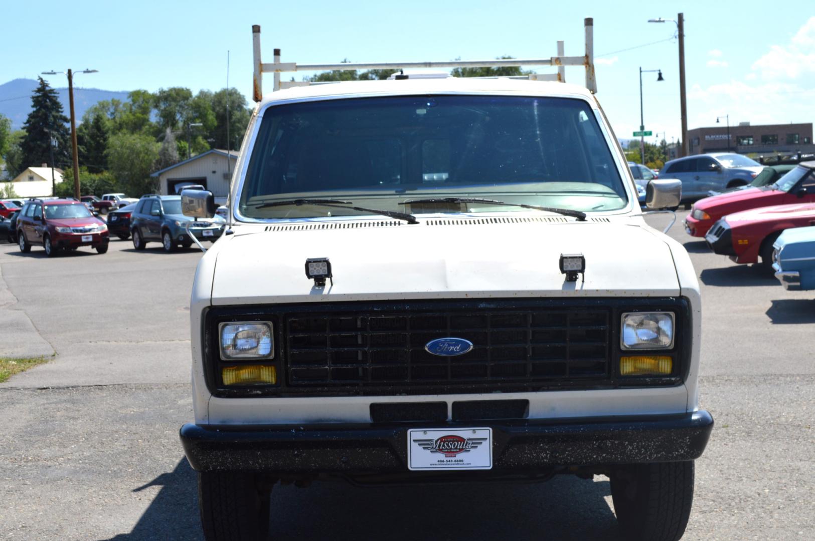 1990 White /Black Ford Econoline E250 (1FTFE24H6LH) with an 5.8L V8 OHV 16V engine, 4-Speed Automatic Overdrive transmission, located at 450 N Russell, Missoula, MT, 59801, (406) 543-6600, 46.874496, -114.017433 - Converted 3/4 Ton Ford Van. Has solar panels on top with a converter for power inside. Had a fold out bed. Comes with a sink that you hook to a 5 gallon water jug. Van Runs great. This vehicle is more then 20 years old and is not eligible for lending through our finance companies. - Photo#2