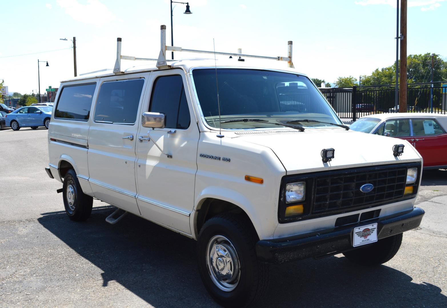 1990 White /Black Ford Econoline E250 (1FTFE24H6LH) with an 5.8L V8 OHV 16V engine, 4-Speed Automatic Overdrive transmission, located at 450 N Russell, Missoula, MT, 59801, (406) 543-6600, 46.874496, -114.017433 - Converted 3/4 Ton Ford Van. Has solar panels on top with a converter for power inside. Had a fold out bed. Comes with a sink that you hook to a 5 gallon water jug. Van Runs great. This vehicle is more then 20 years old and is not eligible for lending through our finance companies. - Photo#3