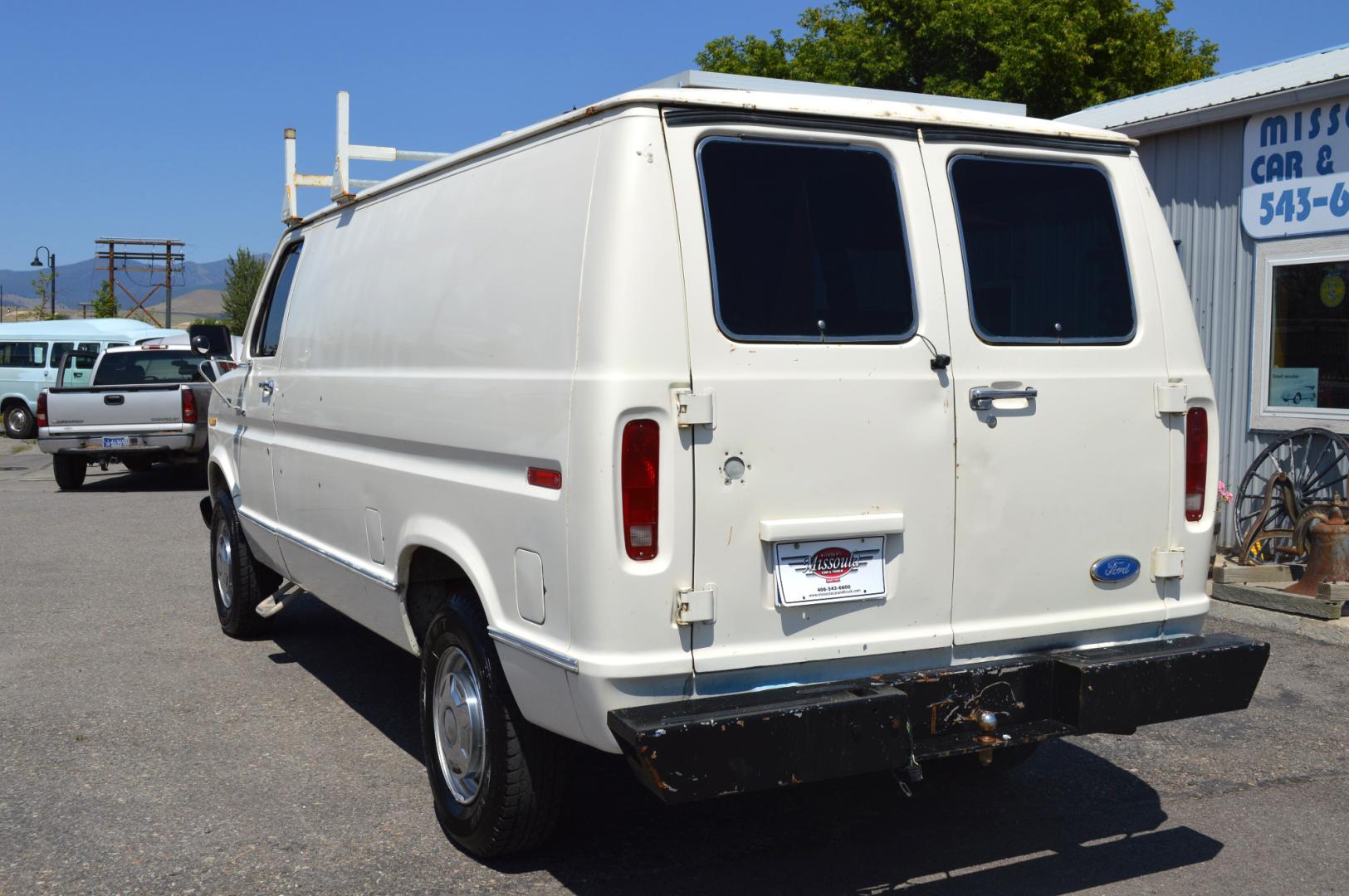 1990 White /Black Ford Econoline E250 (1FTFE24H6LH) with an 5.8L V8 OHV 16V engine, 4-Speed Automatic Overdrive transmission, located at 450 N Russell, Missoula, MT, 59801, (406) 543-6600, 46.874496, -114.017433 - Converted 3/4 Ton Ford Van. Has solar panels on top with a converter for power inside. Had a fold out bed. Comes with a sink that you hook to a 5 gallon water jug. Van Runs great. This vehicle is more then 20 years old and is not eligible for lending through our finance companies. - Photo#7