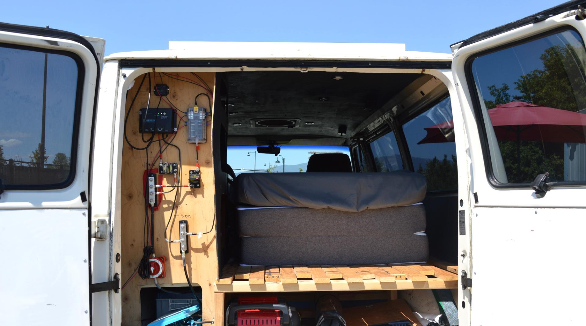 1990 White /Black Ford Econoline E250 (1FTFE24H6LH) with an 5.8L V8 OHV 16V engine, 4-Speed Automatic Overdrive transmission, located at 450 N Russell, Missoula, MT, 59801, (406) 543-6600, 46.874496, -114.017433 - Converted 3/4 Ton Ford Van. Has solar panels on top with a converter for power inside. Had a fold out bed. Comes with a sink that you hook to a 5 gallon water jug. Van Runs great. This vehicle is more then 20 years old and is not eligible for lending through our finance companies. - Photo#8