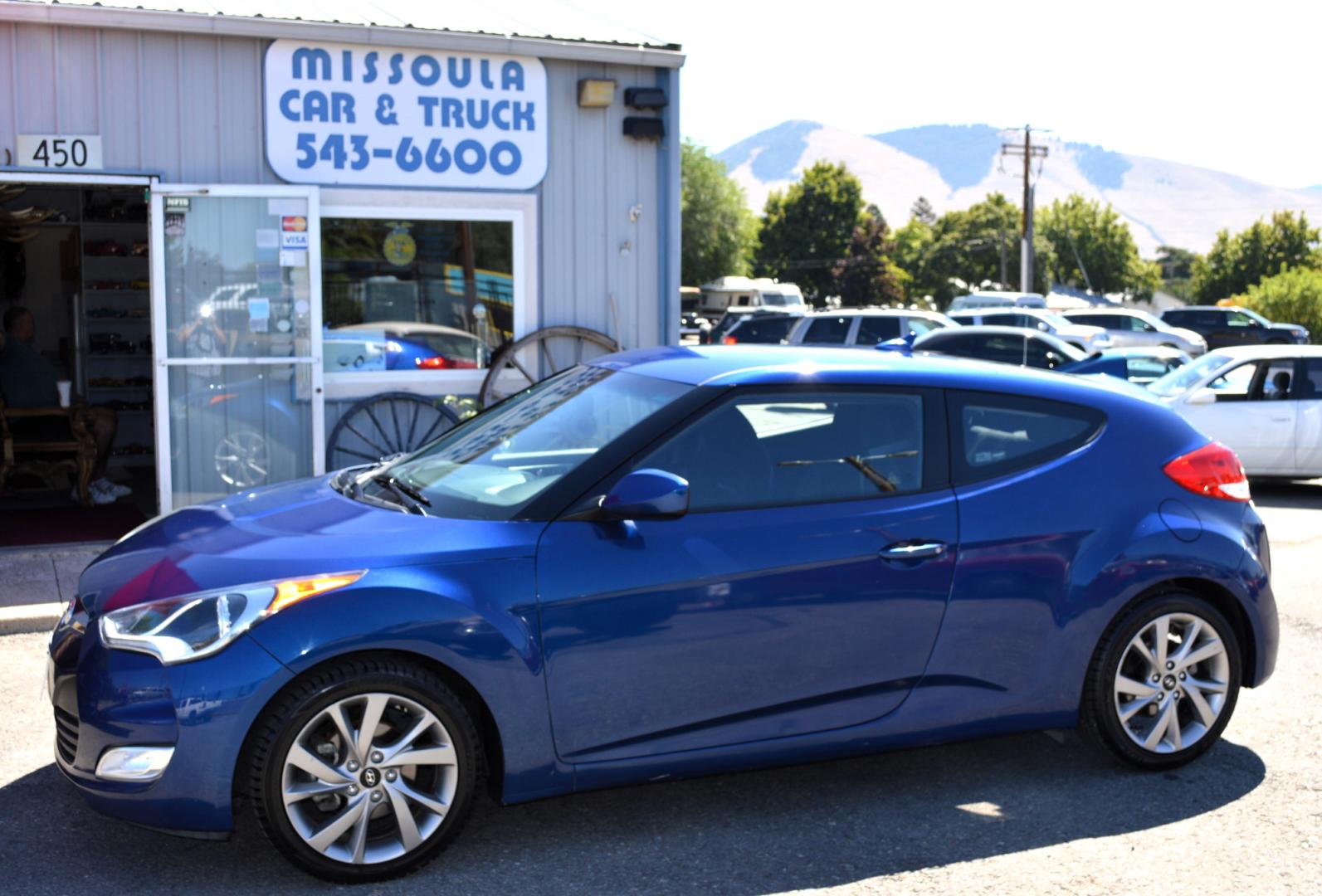 2017 Blue /Black Hyundai Veloster Base 6MT (KMHTC6AD2HU) with an 1.6L L4 DOHC 16V engine, 6M Automatic transmission, located at 450 N Russell, Missoula, MT, 59801, (406) 543-6600, 46.874496, -114.017433 - Cute Little Coupe. 3 Doors. Automatic Transmission. Air. Cruise. Tilt. Power Windows and Locks. Bluetooth. Backup Camera. - Photo#0