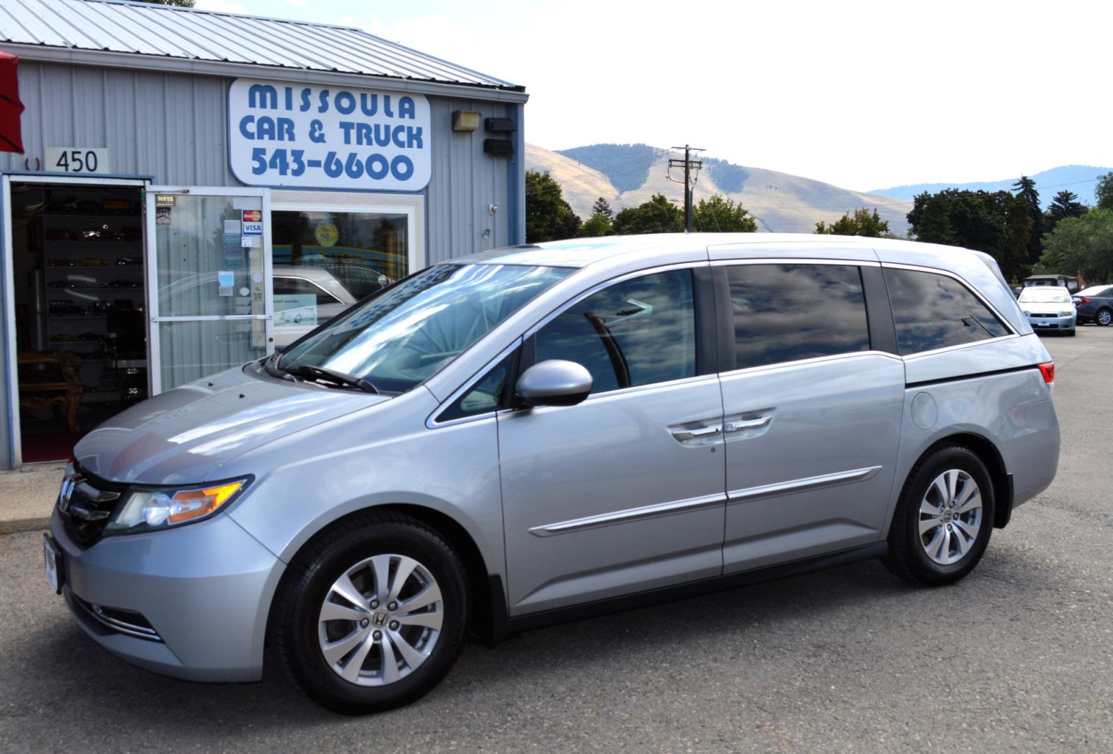 2016 Silver Honda Odyssey EX-L (5FNRL5H6XGB) with an 3.5L V6 SOHC 24V engine, 6A transmission, located at 450 N Russell, Missoula, MT, 59801, (406) 543-6600, 46.874496, -114.017433 - Beautiful Van. Brand NEW Timing Belt. 6 Speed Automatic Transmission. Power Sunroof. 3rd Row Seating. Power Sliding Side Doors. Air. Cruise. Tilt. Power Leather Seats. Stow and Go Rear Seats. - Photo#0