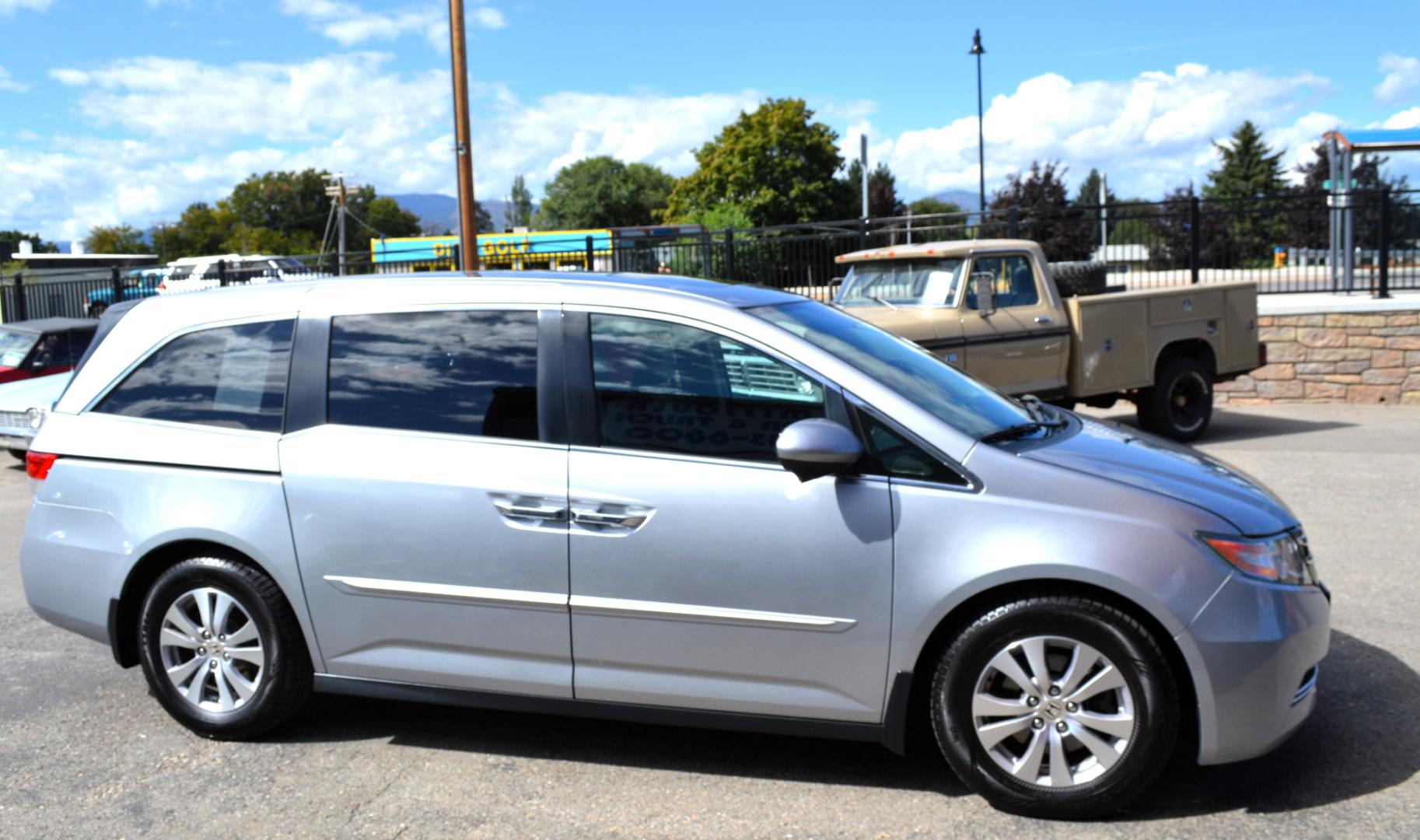 2016 Silver Honda Odyssey EX-L (5FNRL5H6XGB) with an 3.5L V6 SOHC 24V engine, 6A transmission, located at 450 N Russell, Missoula, MT, 59801, (406) 543-6600, 46.874496, -114.017433 - Beautiful Van. Brand NEW Timing Belt. 6 Speed Automatic Transmission. Power Sunroof. 3rd Row Seating. Power Sliding Side Doors. Air. Cruise. Tilt. Power Leather Seats. Stow and Go Rear Seats. - Photo#2