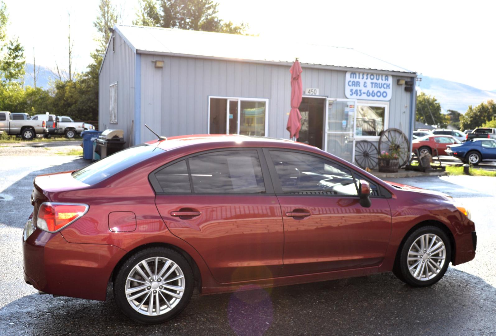 2013 Maroon /Black Subaru Impreza Premium Plus 4-Door (JF1GJAD64DH) with an 2.0L H4 DOHC 16V engine, Automatic transmission, located at 450 N Russell, Missoula, MT, 59801, (406) 543-6600, 46.874496, -114.017433 - All Wheel Drive. Automatic Transmission. Power Sun Roof. Heated Seats. Air. Cruise. Tilt. Power Windows and Locks. Bluetooth. - Photo#0