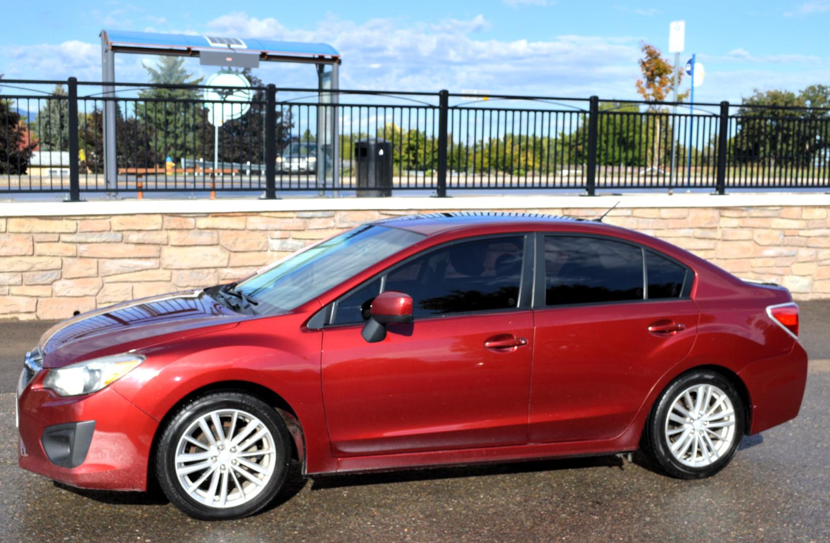 2013 Maroon /Black Subaru Impreza Premium Plus 4-Door (JF1GJAD64DH) with an 2.0L H4 DOHC 16V engine, Automatic transmission, located at 450 N Russell, Missoula, MT, 59801, (406) 543-6600, 46.874496, -114.017433 - All Wheel Drive. Automatic Transmission. Power Sun Roof. Heated Seats. Air. Cruise. Tilt. Power Windows and Locks. Bluetooth. - Photo#1