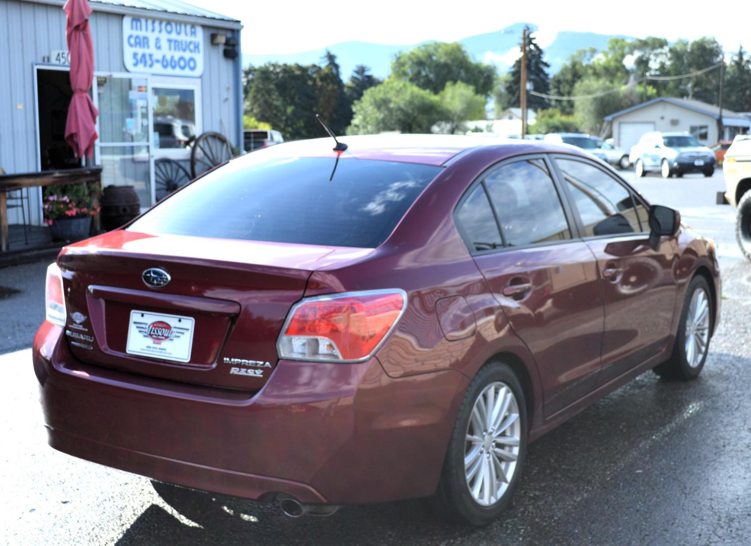 2013 Maroon /Black Subaru Impreza Premium Plus 4-Door (JF1GJAD64DH) with an 2.0L H4 DOHC 16V engine, Automatic transmission, located at 450 N Russell, Missoula, MT, 59801, (406) 543-6600, 46.874496, -114.017433 - All Wheel Drive. Automatic Transmission. Power Sun Roof. Heated Seats. Air. Cruise. Tilt. Power Windows and Locks. Bluetooth. - Photo#2