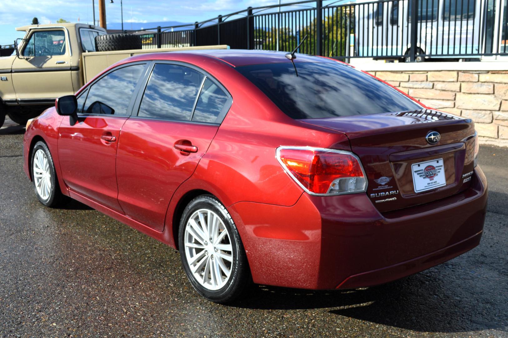 2013 Maroon /Black Subaru Impreza Premium Plus 4-Door (JF1GJAD64DH) with an 2.0L H4 DOHC 16V engine, Automatic transmission, located at 450 N Russell, Missoula, MT, 59801, (406) 543-6600, 46.874496, -114.017433 - All Wheel Drive. Automatic Transmission. Power Sun Roof. Heated Seats. Air. Cruise. Tilt. Power Windows and Locks. Bluetooth. - Photo#4