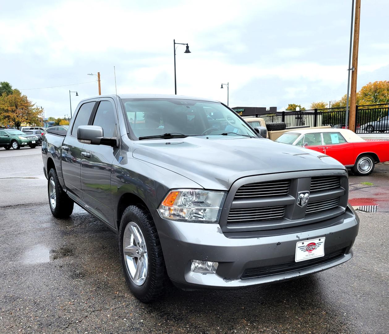 2011 Grey /Black Dodge Ram 1500 ST Crew Cab 4WD (1D7RV1CTXBS) with an 5.7L V8 OHV 16V engine, 5-Speed Automatic transmission, located at 450 N Russell, Missoula, MT, 59801, (406) 543-6600, 46.874496, -114.017433 - Really Nice Truck. Hemi. 4 Wheel Drive. 5 Speed Automatic Transmission. Power Drivers Seat. Air. Cruise. Tilt. AM FM CD Player. Satellite Radio. Power Windows and Locks. Tonneau Cover. Towing. - Photo#2