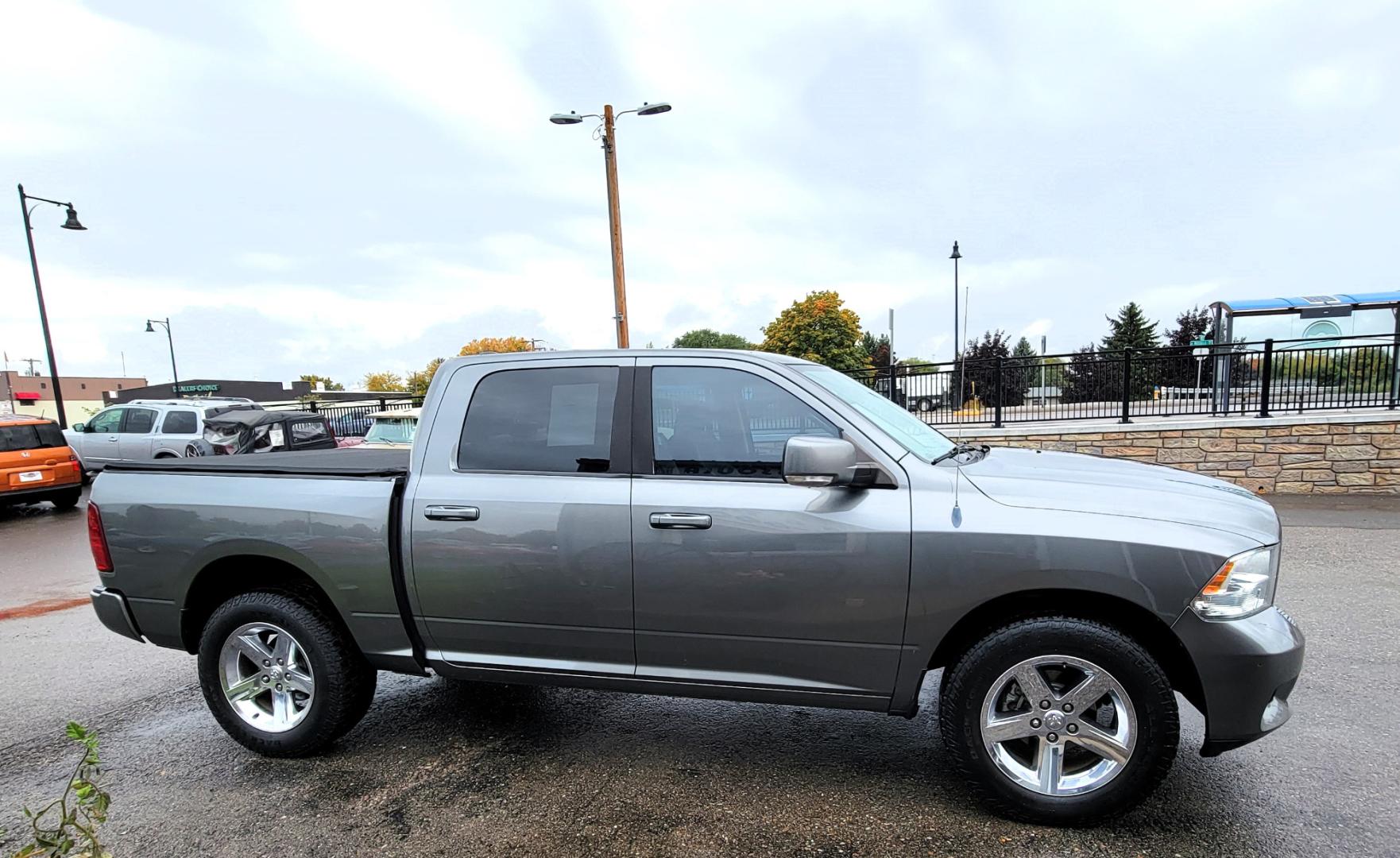 2011 Grey /Black Dodge Ram 1500 ST Crew Cab 4WD (1D7RV1CTXBS) with an 5.7L V8 OHV 16V engine, 5-Speed Automatic transmission, located at 450 N Russell, Missoula, MT, 59801, (406) 543-6600, 46.874496, -114.017433 - Really Nice Truck. Hemi. 4 Wheel Drive. 5 Speed Automatic Transmission. Power Drivers Seat. Air. Cruise. Tilt. AM FM CD Player. Satellite Radio. Power Windows and Locks. Tonneau Cover. Towing. - Photo#3