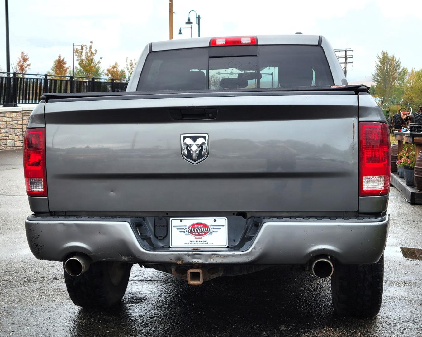 2011 Grey /Black Dodge Ram 1500 ST Crew Cab 4WD (1D7RV1CTXBS) with an 5.7L V8 OHV 16V engine, 5-Speed Automatic transmission, located at 450 N Russell, Missoula, MT, 59801, (406) 543-6600, 46.874496, -114.017433 - Really Nice Truck. Hemi. 4 Wheel Drive. 5 Speed Automatic Transmission. Power Drivers Seat. Air. Cruise. Tilt. AM FM CD Player. Satellite Radio. Power Windows and Locks. Tonneau Cover. Towing. - Photo#5