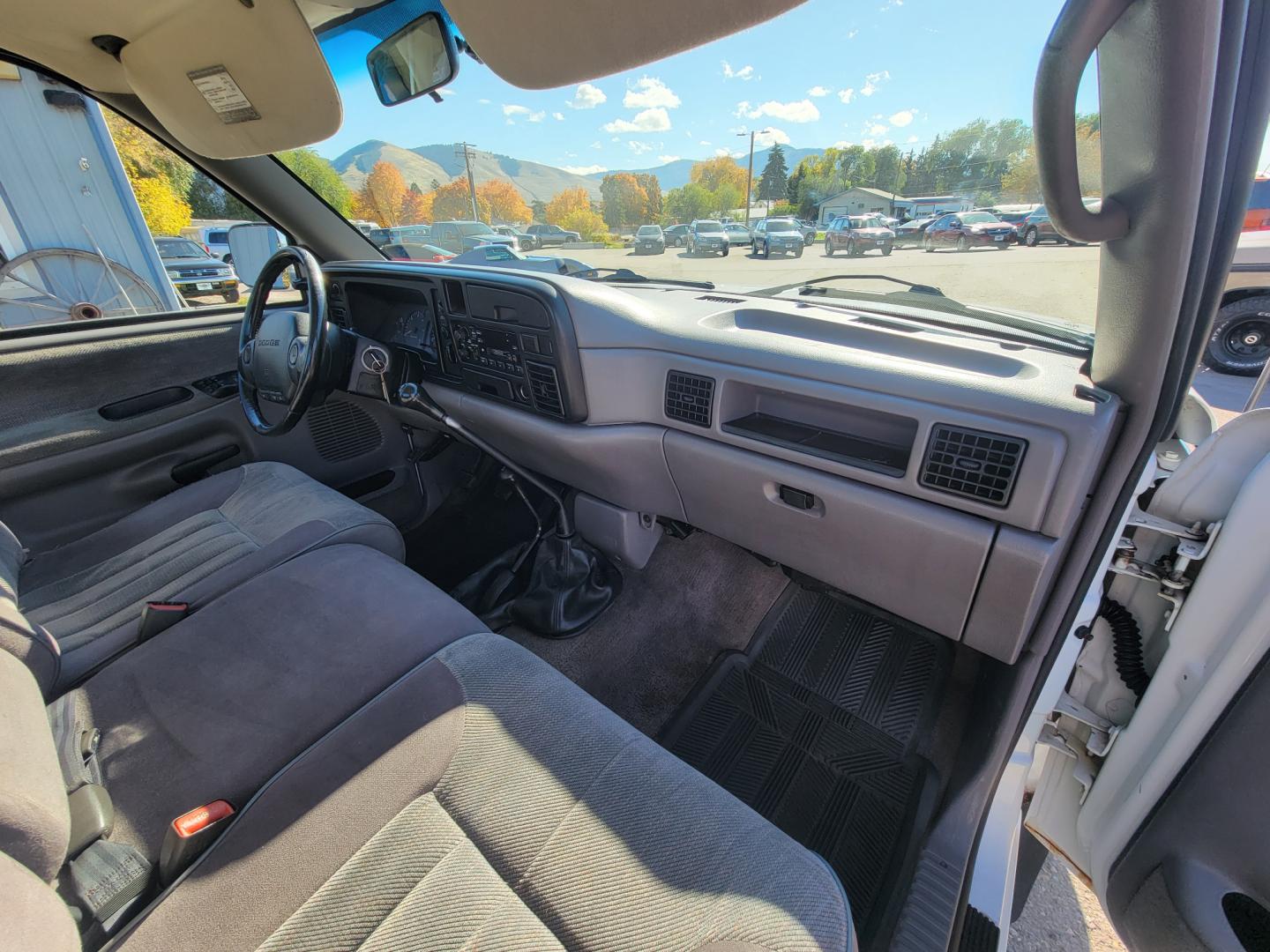 1996 White Dodge Ram 1500 Reg. Cab 8-ft. Bed 4WD (1B7HF16Y2TS) with an 5.2L V8 OHV 16V engine, 5 Speed Manual transmission, located at 450 N Russell, Missoula, MT, 59801, (406) 543-6600, 46.874496, -114.017433 - 5 Speed Manual Transmission. 4 Wheel Drive. Air. Cruise. Tilt. Power Windows and Locks. This vehicle is more then 20 years old and is not eligible for lending through our finance companies. - Photo#14