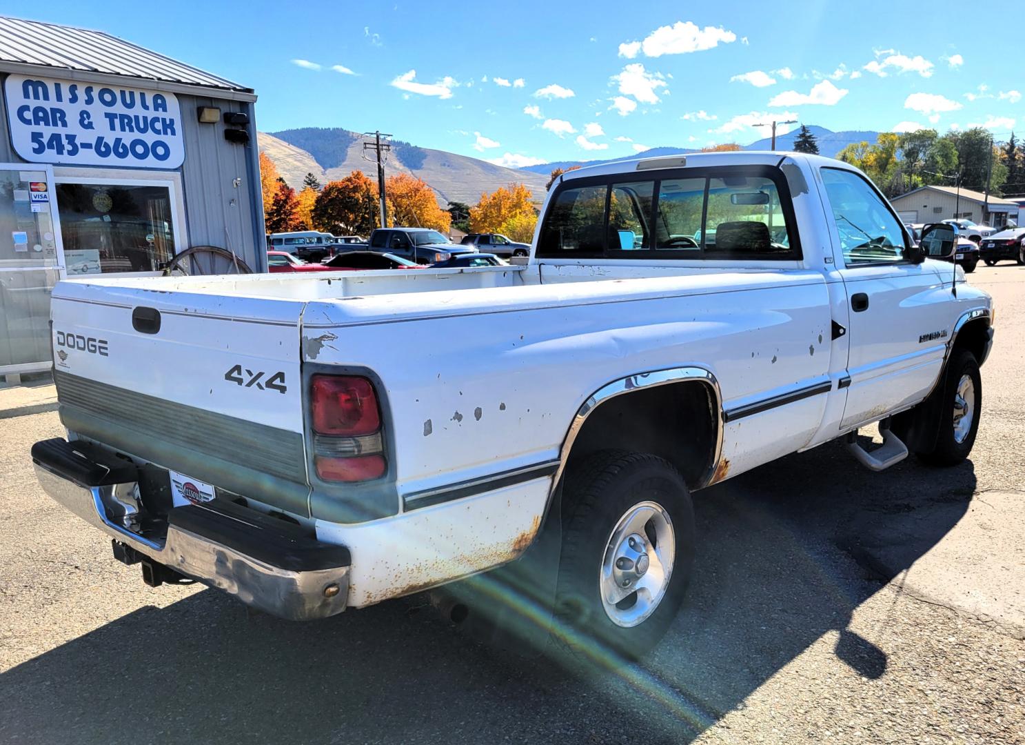 1996 White Dodge Ram 1500 Reg. Cab 8-ft. Bed 4WD (1B7HF16Y2TS) with an 5.2L V8 OHV 16V engine, 5 Speed Manual transmission, located at 450 N Russell, Missoula, MT, 59801, (406) 543-6600, 46.874496, -114.017433 - 5 Speed Manual Transmission. 4 Wheel Drive. Air. Cruise. Tilt. Power Windows and Locks. This vehicle is more then 20 years old and is not eligible for lending through our finance companies. - Photo#2