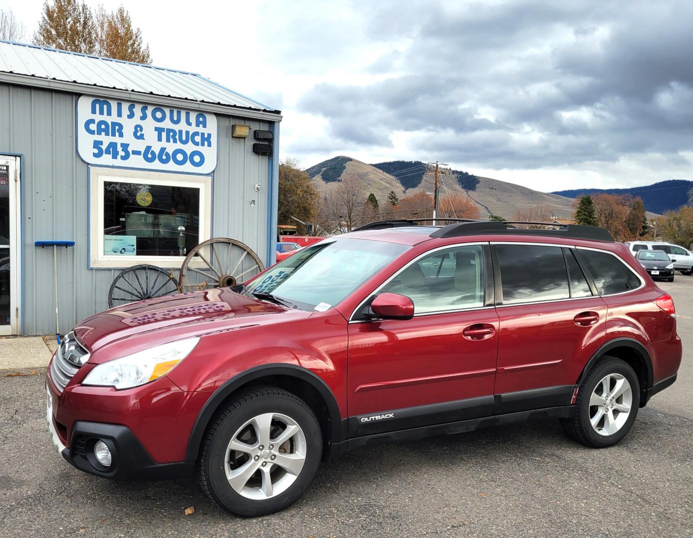 2014 Maroon /Tan Subaru Outback 2.5i Limited (4S4BRBLC2E3) with an 2.5L H4 DOHC 16V engine, 5 Speed Automatic transmission, located at 450 N Russell, Missoula, MT, 59801, (406) 543-6600, 46.874496, -114.017433 - Automatic. AWD. Power Sunroof. Heated Power Leather Seats. AM FM CD Player. Bluetooth. - Photo#0