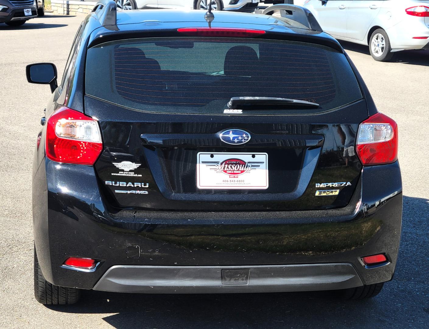 2015 Black /Black Subaru Impreza Sport Premium (JF1GPAU63F8) with an 2.0L engine, Automatic / CVT transmission, located at 450 N Russell, Missoula, MT, 59801, (406) 543-6600, 46.874496, -114.017433 - Only 78K Miles. 2.0L H4 Engine. CVT Automatic Transmission. All Wheel Drive. Backup Camera. Power Sunroof. Heated Seats. Power Windows and Locks. Air Cruise Tilt. Bluetooth. Has a dent in Passenger Door. - Photo#5