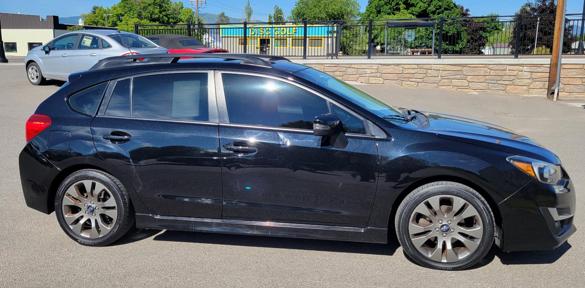 2015 Black /Black Subaru Impreza Sport Premium (JF1GPAU63F8) with an 2.0L engine, Automatic / CVT transmission, located at 450 N Russell, Missoula, MT, 59801, (406) 543-6600, 46.874496, -114.017433 - Only 78K Miles. 2.0L H4 Engine. CVT Automatic Transmission. All Wheel Drive. Backup Camera. Power Sunroof. Heated Seats. Power Windows and Locks. Air Cruise Tilt. Bluetooth. Has a dent in Passenger Door. - Photo#0