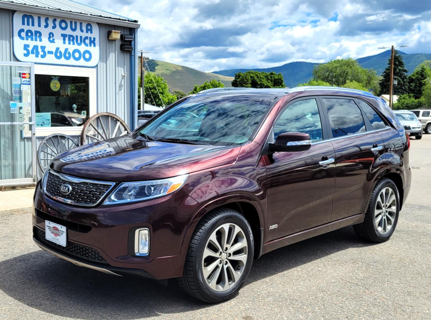 2014 Maroon /Black Kia Sorento SX (5XYKWDA7XEG) with an 3.3L V6 engine, 6 Speed Auto transmission, located at 450 N Russell, Missoula, MT, 59801, (406) 543-6600, 46.874496, -114.017433 - Beautiful AWD SUV. 3.3L V6 Engine. 6 Speed Automatic Transmission. Power Sunroof. Heated Leather Power Seats. Navigation. 3rd Row Seating. Bluetooth. Backup Camera. Front and Rear Climate Control. Power Rear Gate. Clean Carfax. - Photo#1