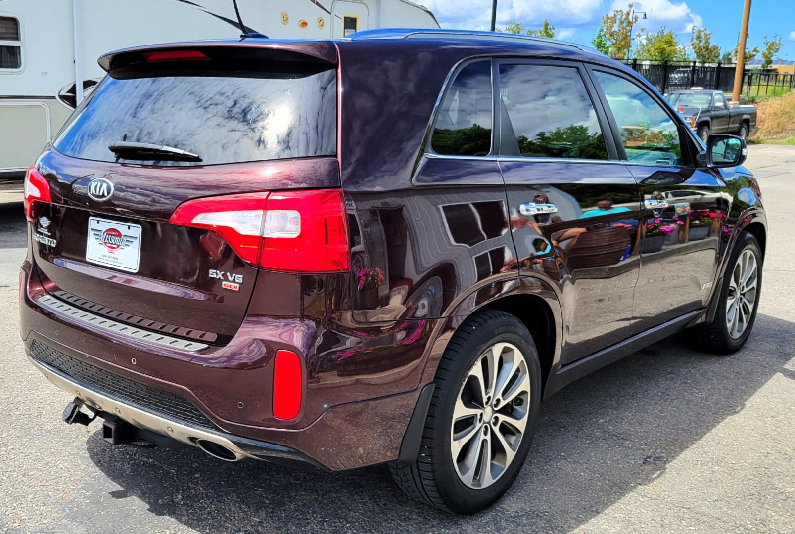 2014 Maroon /Black Kia Sorento SX (5XYKWDA7XEG) with an 3.3L V6 engine, 6 Speed Auto transmission, located at 450 N Russell, Missoula, MT, 59801, (406) 543-6600, 46.874496, -114.017433 - Beautiful AWD SUV. 3.3L V6 Engine. 6 Speed Automatic Transmission. Power Sunroof. Heated Leather Power Seats. Navigation. 3rd Row Seating. Bluetooth. Backup Camera. Front and Rear Climate Control. Power Rear Gate. Clean Carfax. - Photo#5