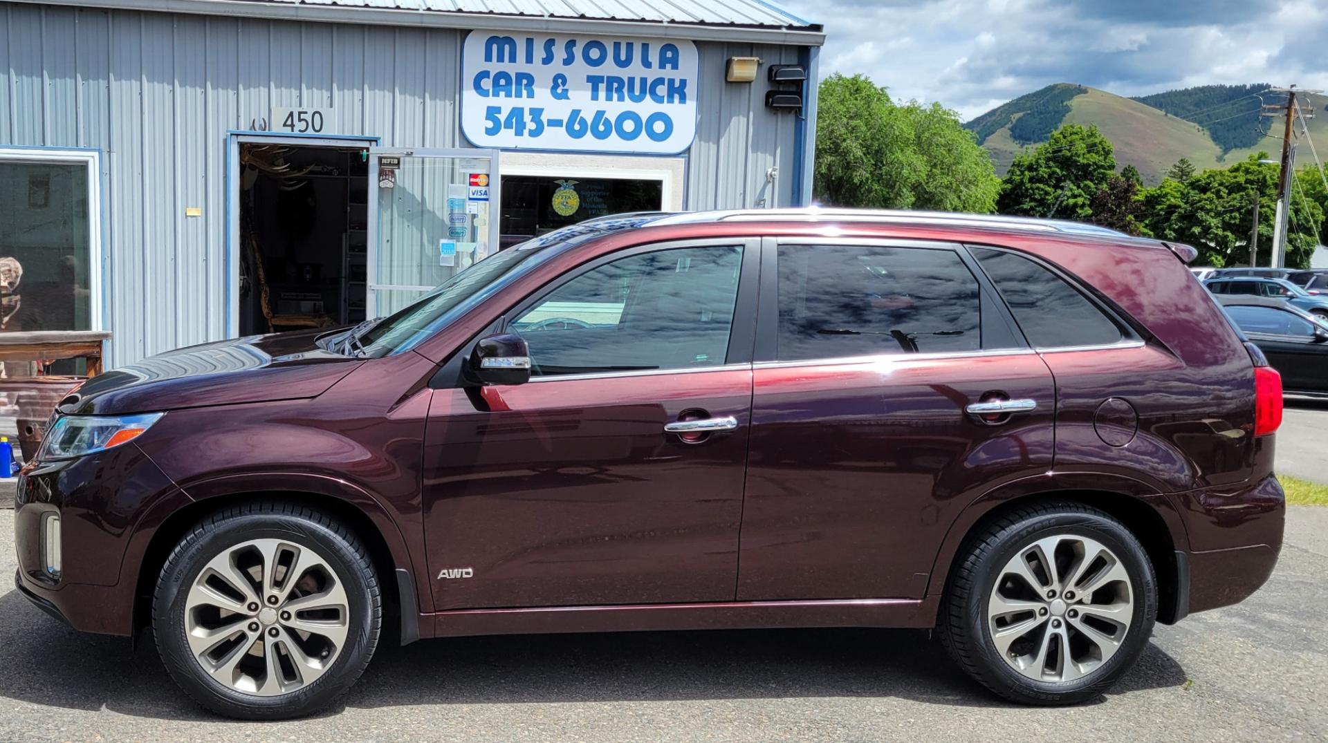 2014 Maroon /Black Kia Sorento SX (5XYKWDA7XEG) with an 3.3L V6 engine, 6 Speed Auto transmission, located at 450 N Russell, Missoula, MT, 59801, (406) 543-6600, 46.874496, -114.017433 - Beautiful AWD SUV. 3.3L V6 Engine. 6 Speed Automatic Transmission. Power Sunroof. Heated Leather Power Seats. Navigation. 3rd Row Seating. Bluetooth. Backup Camera. Front and Rear Climate Control. Power Rear Gate. Clean Carfax. - Photo#0