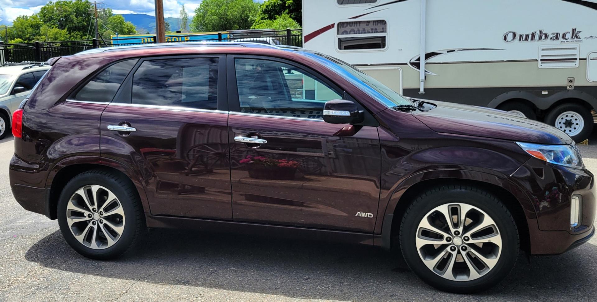 2014 Maroon /Black Kia Sorento SX (5XYKWDA7XEG) with an 3.3L V6 engine, 6 Speed Auto transmission, located at 450 N Russell, Missoula, MT, 59801, (406) 543-6600, 46.874496, -114.017433 - Beautiful AWD SUV. 3.3L V6 Engine. 6 Speed Automatic Transmission. Power Sunroof. Heated Leather Power Seats. Navigation. 3rd Row Seating. Bluetooth. Backup Camera. Front and Rear Climate Control. Power Rear Gate. Clean Carfax. - Photo#4