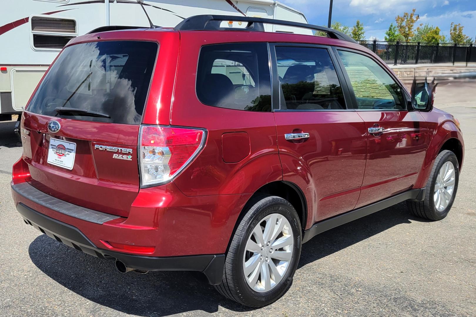 2012 Red /Tan Subaru Forester 2.5X Limited (JF2SHAECXCH) with an 2.5L H4 engine, 4 Speed Auto transmission, located at 450 N Russell, Missoula, MT, 59801, (406) 543-6600, 46.874496, -114.017433 - All Wheel Drive. 2.5L H4 Engine. 4 Speed manual Transmission. Huge Power Sunroof. Air. Cruise. Tilt. Heated Seats. Bluetooth. AM FM XM CD. Backup Camera. Runs Great!Timing Chain not Timing Belt. - Photo#5