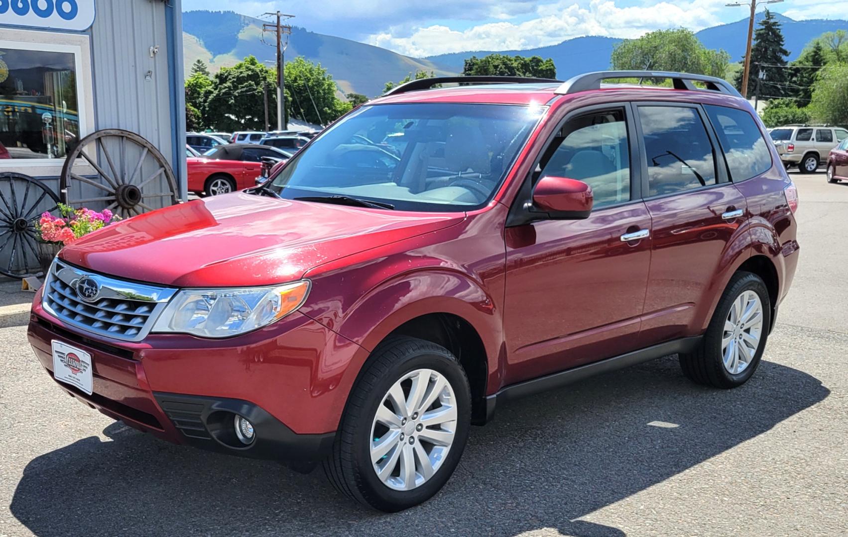 2012 Red /Tan Subaru Forester 2.5X Limited (JF2SHAECXCH) with an 2.5L H4 engine, 4 Speed Auto transmission, located at 450 N Russell, Missoula, MT, 59801, (406) 543-6600, 46.874496, -114.017433 - All Wheel Drive. 2.5L H4 Engine. 4 Speed manual Transmission. Huge Power Sunroof. Air. Cruise. Tilt. Heated Seats. Bluetooth. AM FM XM CD. Backup Camera. Runs Great!Timing Chain not Timing Belt. - Photo#1