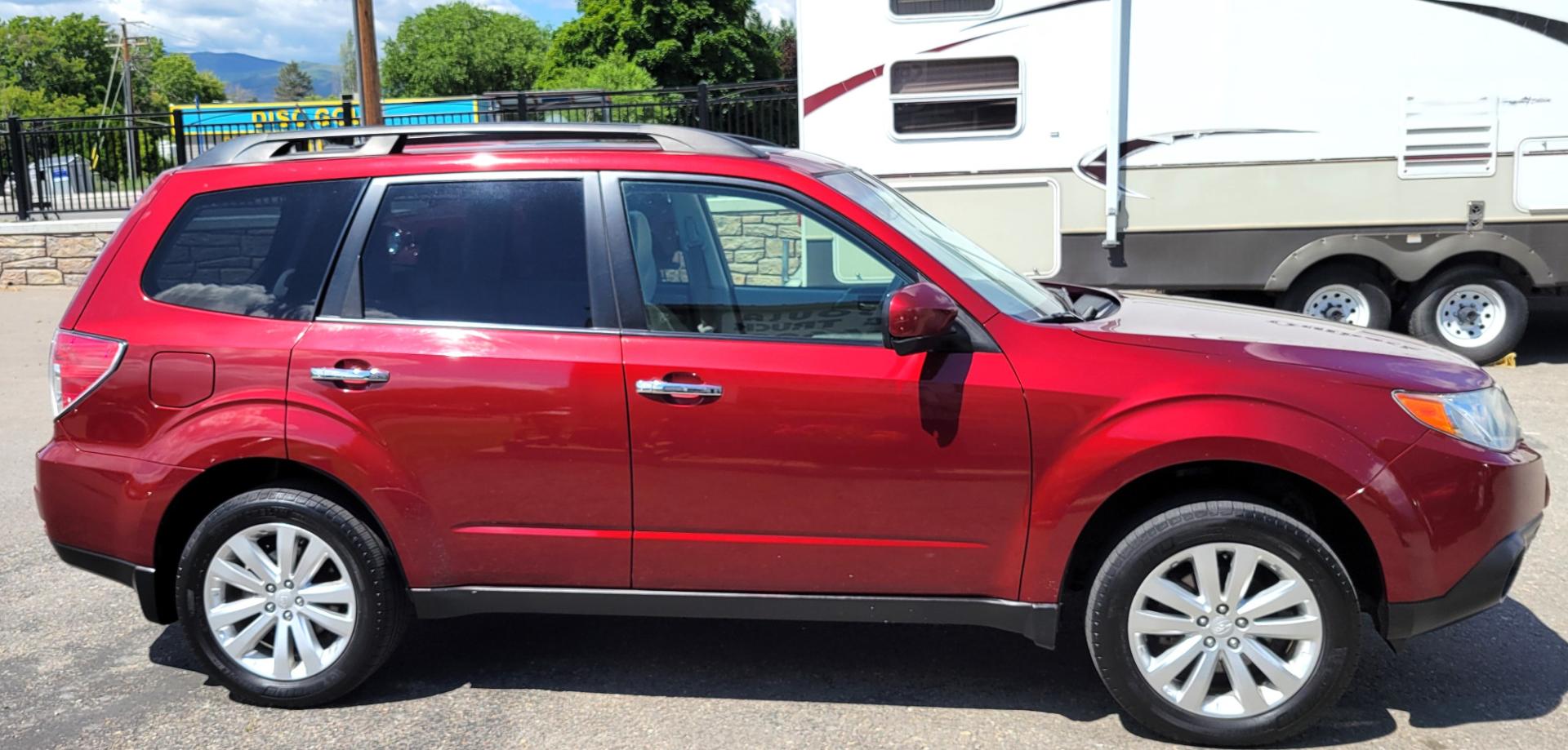 2012 Red /Tan Subaru Forester 2.5X Limited (JF2SHAECXCH) with an 2.5L H4 engine, 4 Speed Auto transmission, located at 450 N Russell, Missoula, MT, 59801, (406) 543-6600, 46.874496, -114.017433 - All Wheel Drive. 2.5L H4 Engine. 4 Speed manual Transmission. Huge Power Sunroof. Air. Cruise. Tilt. Heated Seats. Bluetooth. AM FM XM CD. Backup Camera. Runs Great!Timing Chain not Timing Belt. - Photo#4