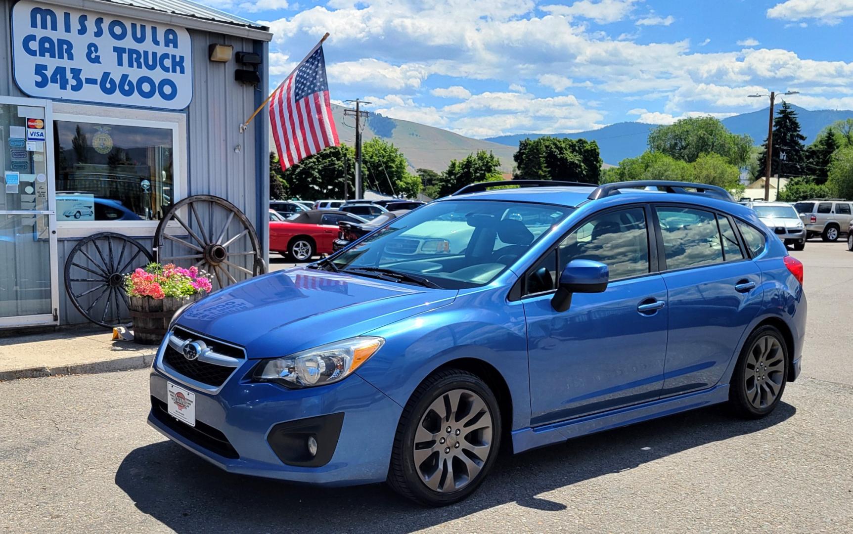 2014 Blue /Black Subaru Impreza 2.0 Sport Premium (JF1GPAL63E9) with an 2.0L H4 engine, 5 Speed Manual transmission, located at 450 N Russell, Missoula, MT, 59801, (406) 543-6600, 46.874496, -114.017433 - 1 Owner. Clean Carfax. Great Gas Mileage. AWD. 5 Speed Manual Transmission. 2.0L H4 Engine. Bluetooth. Heated Seats. Power Windows and Locks. Air Cruise Tilt. AM CD CD. Tires are Excellent. - Photo#1