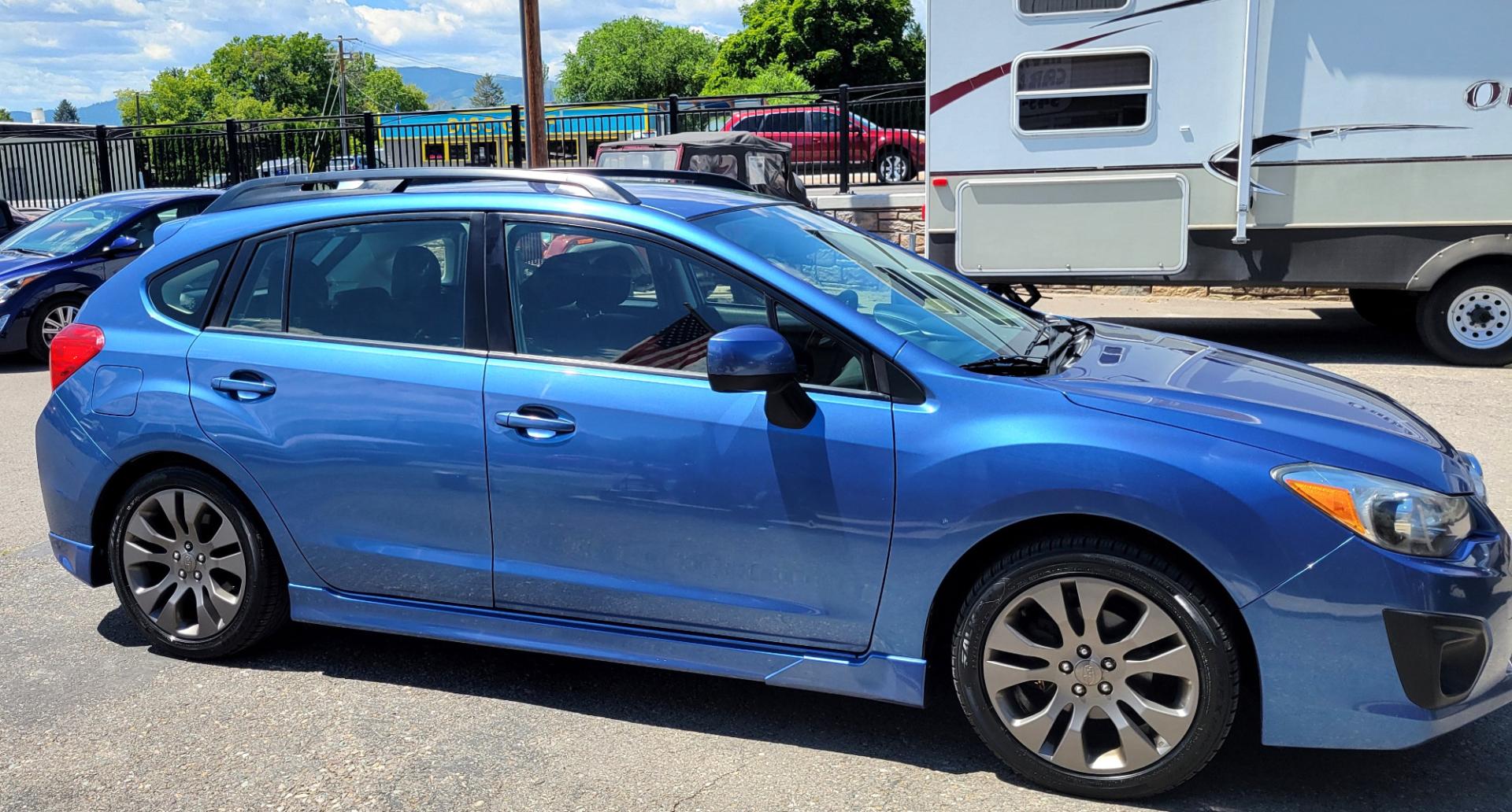 2014 Blue /Black Subaru Impreza 2.0 Sport Premium (JF1GPAL63E9) with an 2.0L H4 engine, 5 Speed Manual transmission, located at 450 N Russell, Missoula, MT, 59801, (406) 543-6600, 46.874496, -114.017433 - 1 Owner. Clean Carfax. Great Gas Mileage. AWD. 5 Speed Manual Transmission. 2.0L H4 Engine. Bluetooth. Heated Seats. Power Windows and Locks. Air Cruise Tilt. AM CD CD. Tires are Excellent. - Photo#3