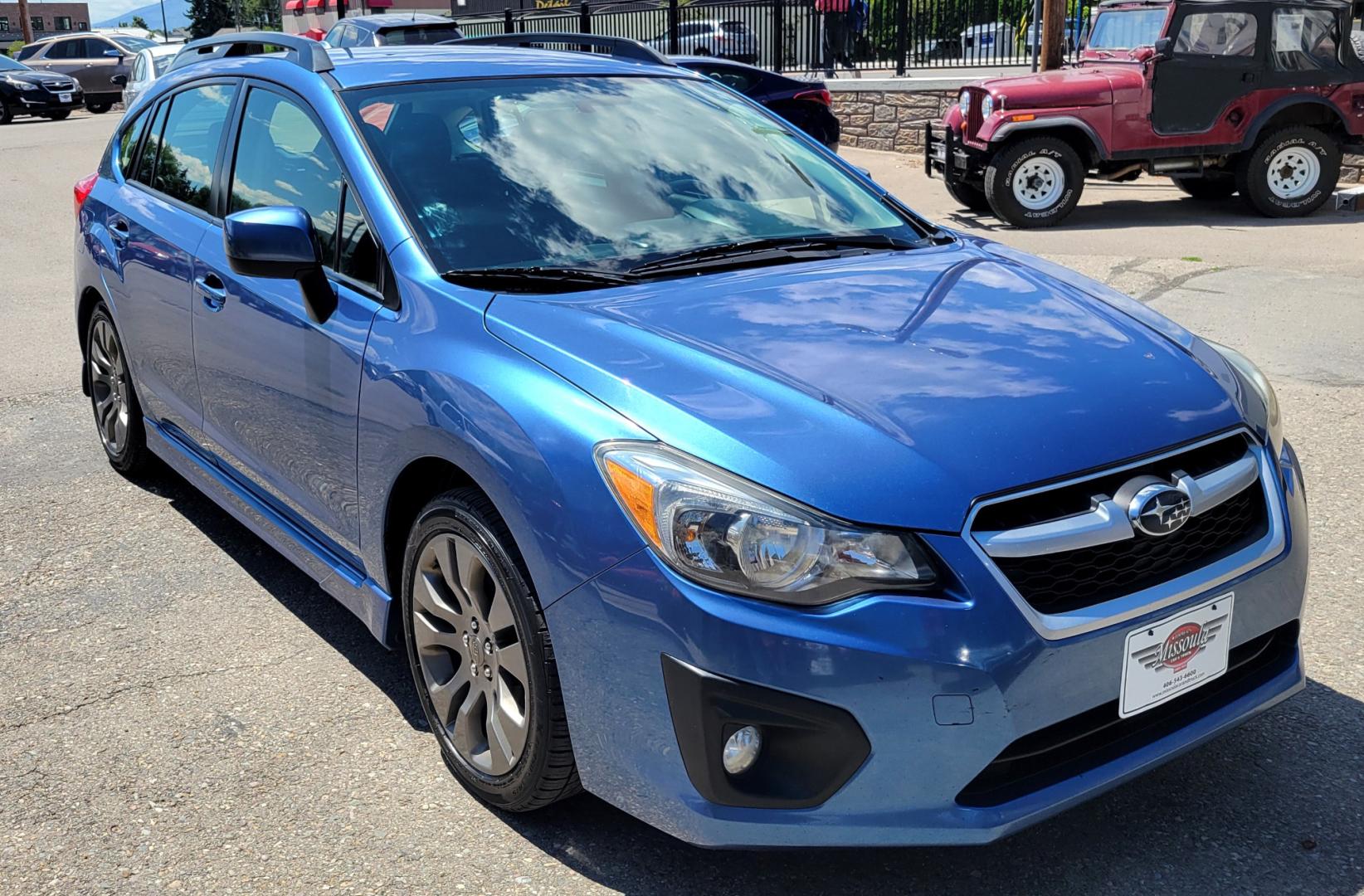 2014 Blue /Black Subaru Impreza 2.0 Sport Premium (JF1GPAL63E9) with an 2.0L H4 engine, 5 Speed Manual transmission, located at 450 N Russell, Missoula, MT, 59801, (406) 543-6600, 46.874496, -114.017433 - 1 Owner. Clean Carfax. Great Gas Mileage. AWD. 5 Speed Manual Transmission. 2.0L H4 Engine. Bluetooth. Heated Seats. Power Windows and Locks. Air Cruise Tilt. AM CD CD. Tires are Excellent. - Photo#2