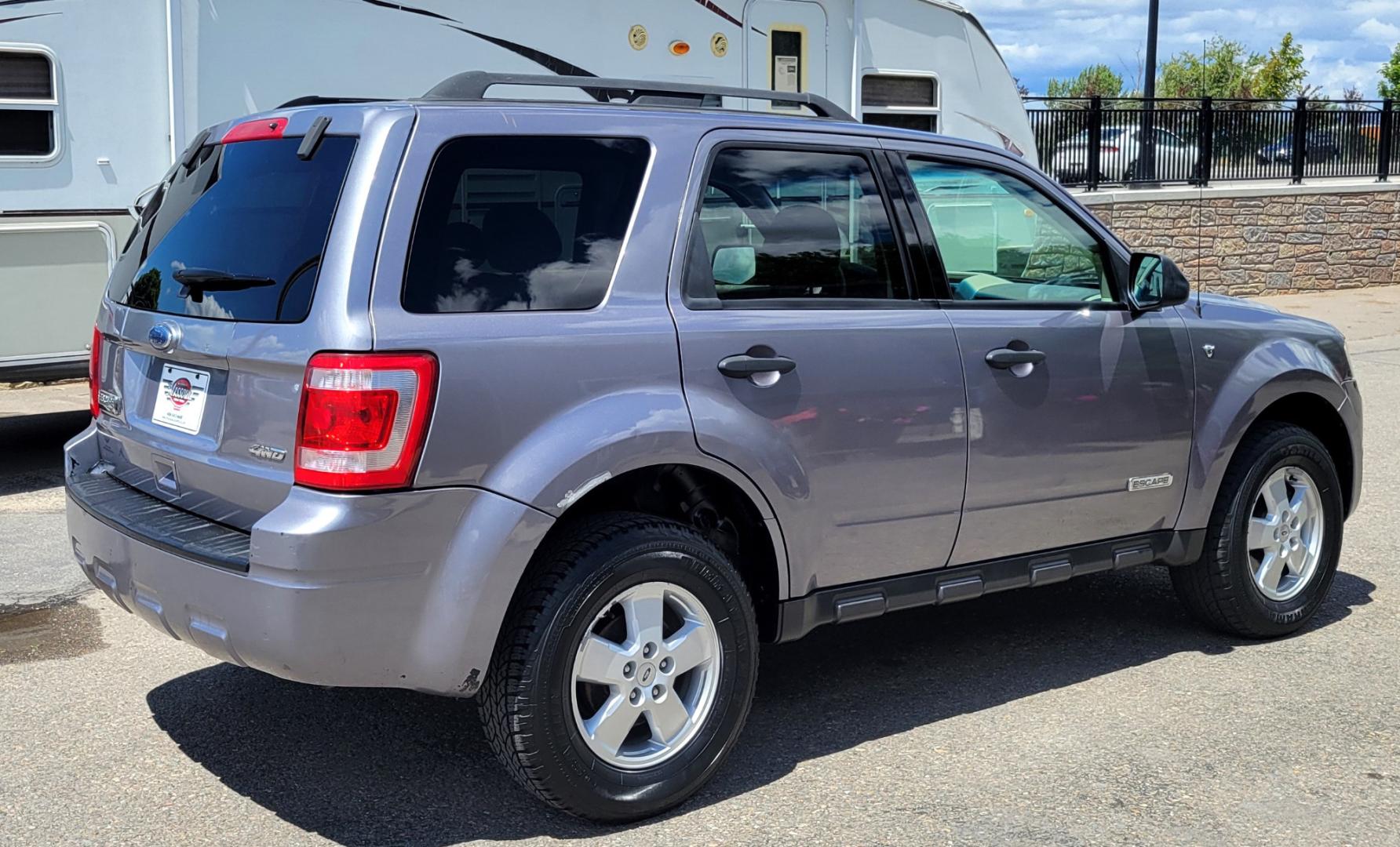 2008 Grey /Tan Ford Escape (1FMCU93138K) with an 3.0L V6 engine, 4 Speed Automatic transmission, located at 450 N Russell, Missoula, MT, 59801, (406) 543-6600, 46.874496, -114.017433 - Runs Great. 3.0L V6 Engine. All Wheel Drive. 4 Speed Automatic Transmission. Good Tires. Power Windows and Locks. Air. Cruise. Tilt. Power Drivers Seat. AM FM CD. - Photo#5