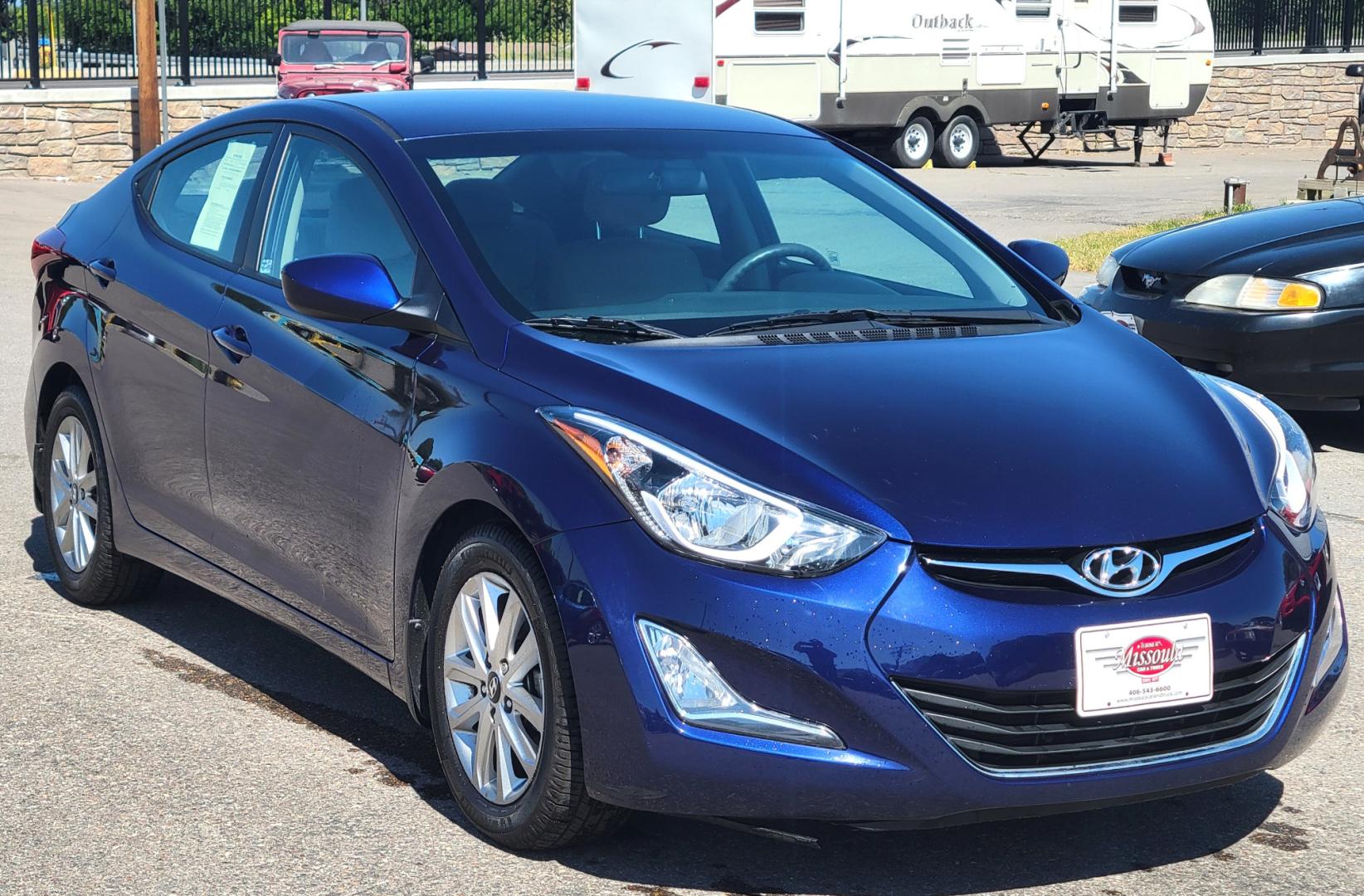 2014 Blue /Tan Hyundai Elantra SE (5NPDH4AE8EH) with an 1.8L L4 engine, 6 Speed Auto transmission, located at 450 N Russell, Missoula, MT, 59801, (406) 543-6600, 46.874496, -114.017433 - Nice little Sedan. Only 48358 Miles. 1.8L L4 Engine. 6 Speed Automatic Transmission. Great Fuel Economy. Heated Seats. Bluetooth. Backup Camera. AM FM CD. Power Windows and Locks. Air. Cruise. Tilt. There is a scuff by the left rear tire. - Photo#2