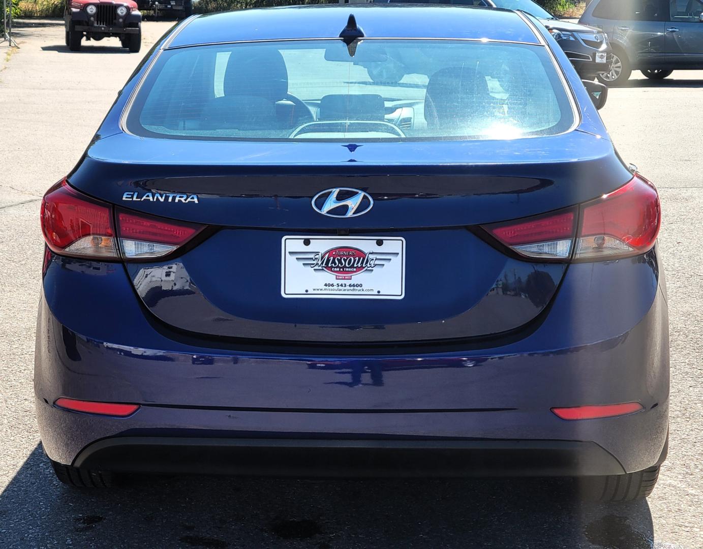 2014 Blue /Tan Hyundai Elantra SE (5NPDH4AE8EH) with an 1.8L L4 engine, 6 Speed Auto transmission, located at 450 N Russell, Missoula, MT, 59801, (406) 543-6600, 46.874496, -114.017433 - Nice little Sedan. Only 48358 Miles. 1.8L L4 Engine. 6 Speed Automatic Transmission. Great Fuel Economy. Heated Seats. Bluetooth. Backup Camera. AM FM CD. Power Windows and Locks. Air. Cruise. Tilt. There is a scuff by the left rear tire. - Photo#4