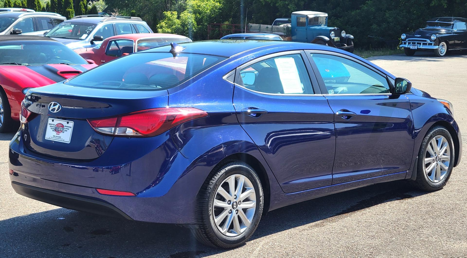 2014 Blue /Tan Hyundai Elantra SE (5NPDH4AE8EH) with an 1.8L L4 engine, 6 Speed Auto transmission, located at 450 N Russell, Missoula, MT, 59801, (406) 543-6600, 46.874496, -114.017433 - Nice little Sedan. Only 48358 Miles. 1.8L L4 Engine. 6 Speed Automatic Transmission. Great Fuel Economy. Heated Seats. Bluetooth. Backup Camera. AM FM CD. Power Windows and Locks. Air. Cruise. Tilt. There is a scuff by the left rear tire. - Photo#3