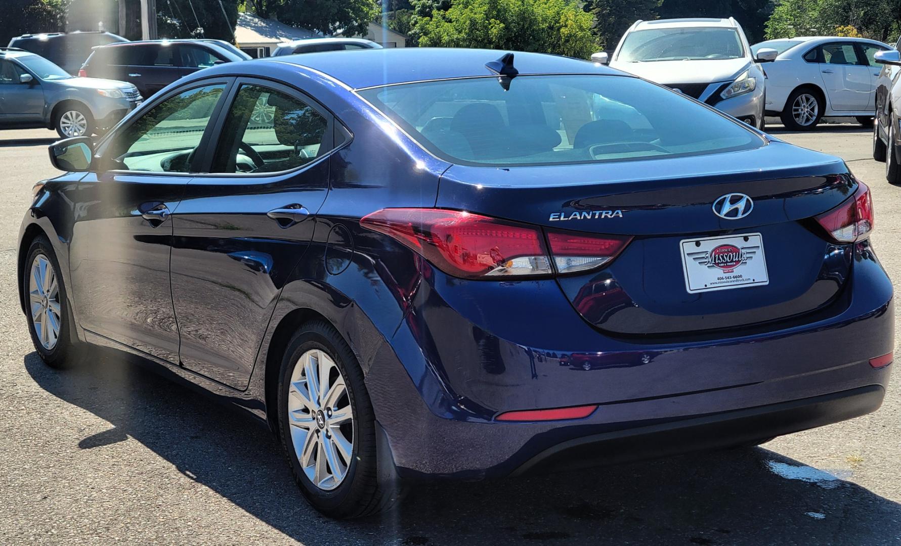 2014 Blue /Tan Hyundai Elantra SE (5NPDH4AE8EH) with an 1.8L L4 engine, 6 Speed Auto transmission, located at 450 N Russell, Missoula, MT, 59801, (406) 543-6600, 46.874496, -114.017433 - Nice little Sedan. Only 48358 Miles. 1.8L L4 Engine. 6 Speed Automatic Transmission. Great Fuel Economy. Heated Seats. Bluetooth. Backup Camera. AM FM CD. Power Windows and Locks. Air. Cruise. Tilt. There is a scuff by the left rear tire. - Photo#5