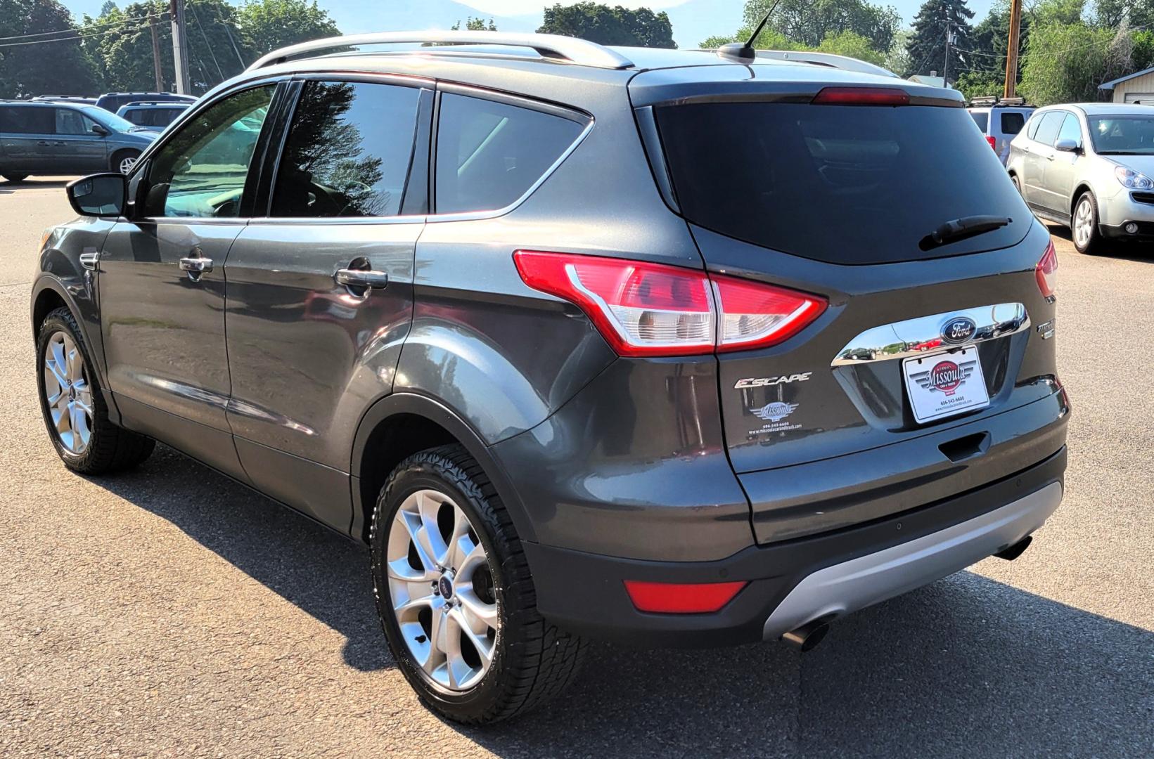 2016 Grey /Black Ford Escape Titanium 4WD (1FMCU9J91GU) with an 2.0L L4 engine, 6 Speed Auto transmission, located at 450 N Russell, Missoula, MT, 59801, (406) 543-6600, 46.874496, -114.017433 - Nice Little 4WD SUV. 2.0L L4 Engine. 6 Speed Automatic Transmission. Heated Seats. Power Lift Gate. Bluetooth. Backup Camera. Touch Screen. AM FM CD. Power Drivers Seat. Fog Lights. Roof Rack Rails. Remote Start. Weather Tech Floor Liners. - Photo#2