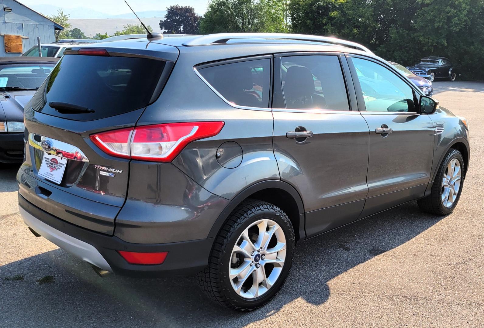 2016 Grey /Black Ford Escape Titanium 4WD (1FMCU9J91GU) with an 2.0L L4 engine, 6 Speed Auto transmission, located at 450 N Russell, Missoula, MT, 59801, (406) 543-6600, 46.874496, -114.017433 - Nice Little 4WD SUV. 2.0L L4 Engine. 6 Speed Automatic Transmission. Heated Seats. Power Lift Gate. Bluetooth. Backup Camera. Touch Screen. AM FM CD. Power Drivers Seat. Fog Lights. Roof Rack Rails. Remote Start. Weather Tech Floor Liners. - Photo#6