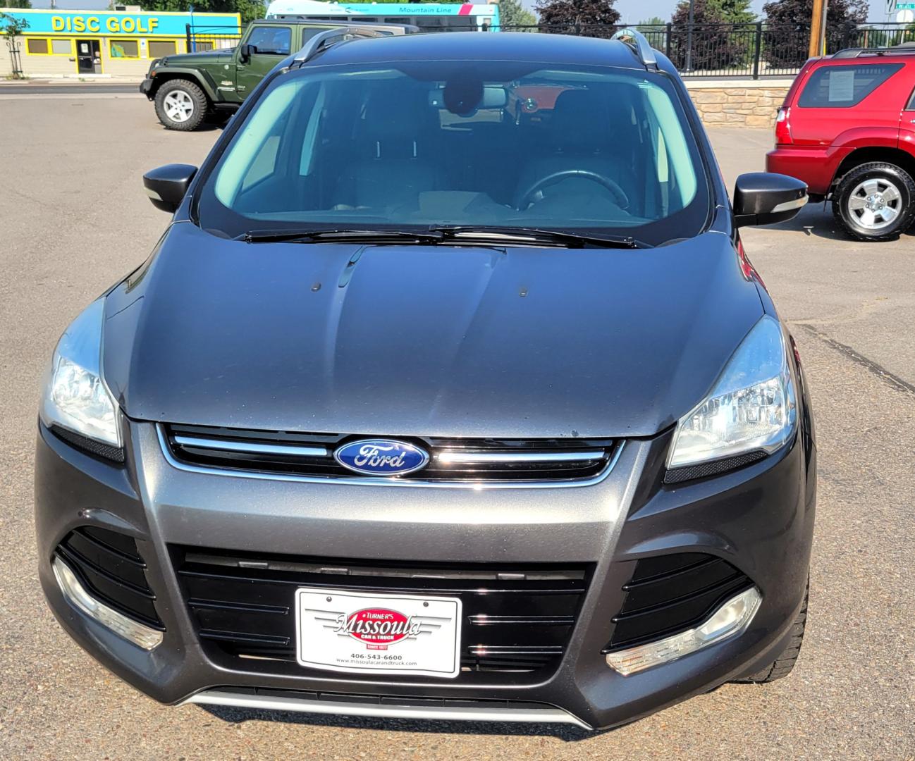 2016 Grey /Black Ford Escape Titanium 4WD (1FMCU9J91GU) with an 2.0L L4 engine, 6 Speed Auto transmission, located at 450 N Russell, Missoula, MT, 59801, (406) 543-6600, 46.874496, -114.017433 - Nice Little 4WD SUV. 2.0L L4 Engine. 6 Speed Automatic Transmission. Heated Seats. Power Lift Gate. Bluetooth. Backup Camera. Touch Screen. AM FM CD. Power Drivers Seat. Fog Lights. Roof Rack Rails. Remote Start. Weather Tech Floor Liners. - Photo#4